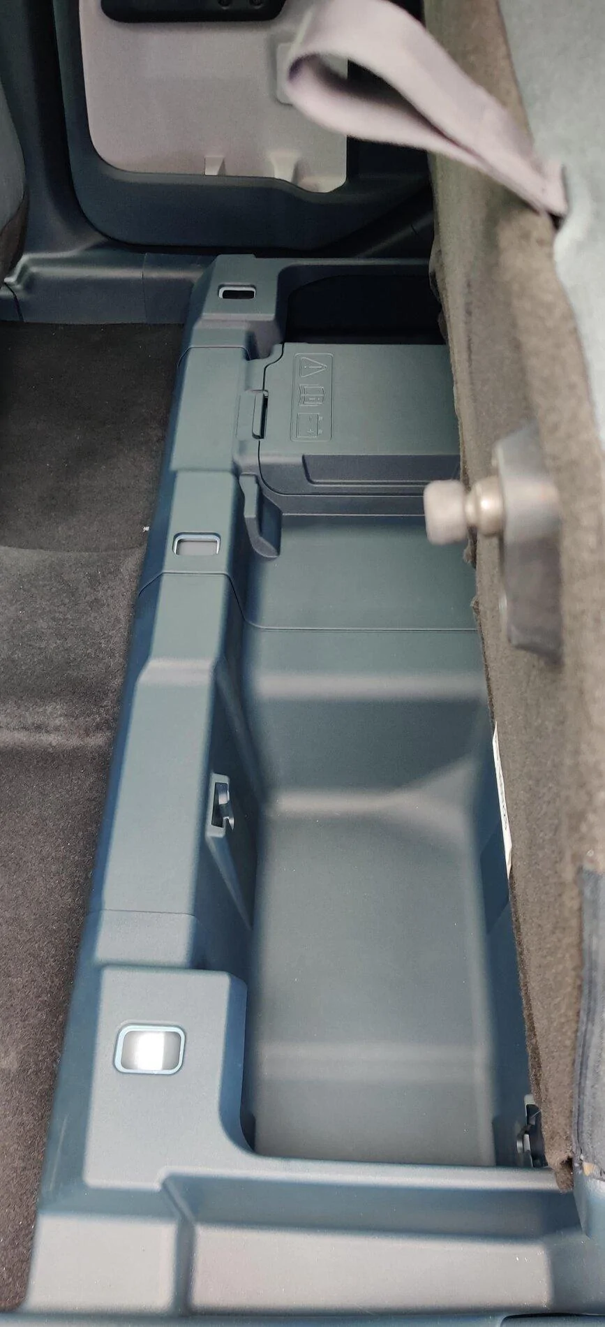 Ford Maverick Chicago Pics: 2022 Maverick Interior, Underhood / Engine, Rear Sliding Window, 4x4 Studs, Spare Tire, Undercarriage, Trailer Brake Controller Maverick under bench seat storage bin compartment 1