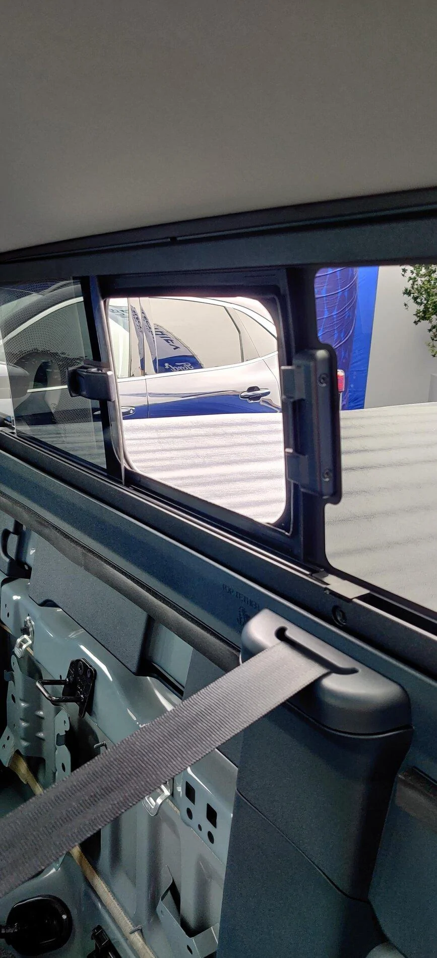 Ford Maverick Chicago Pics: 2022 Maverick Interior, Underhood / Engine, Rear Sliding Window, 4x4 Studs, Spare Tire, Undercarriage, Trailer Brake Controller Rear Sliding Window Port Maverick XLT hybrid 13