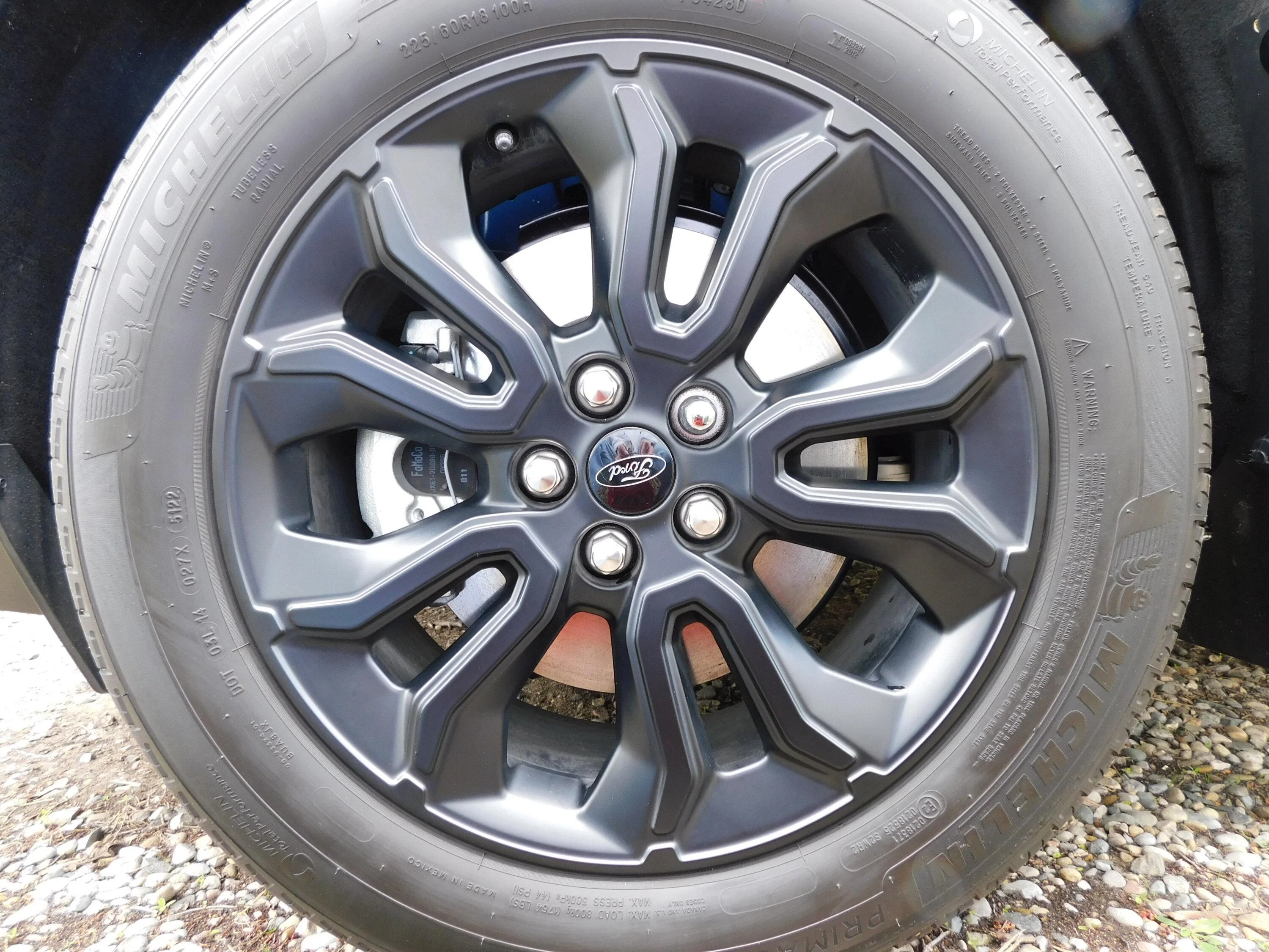 Ford Maverick I replaced the two piece stock lug nuts with one piece black lug nuts. before lugs