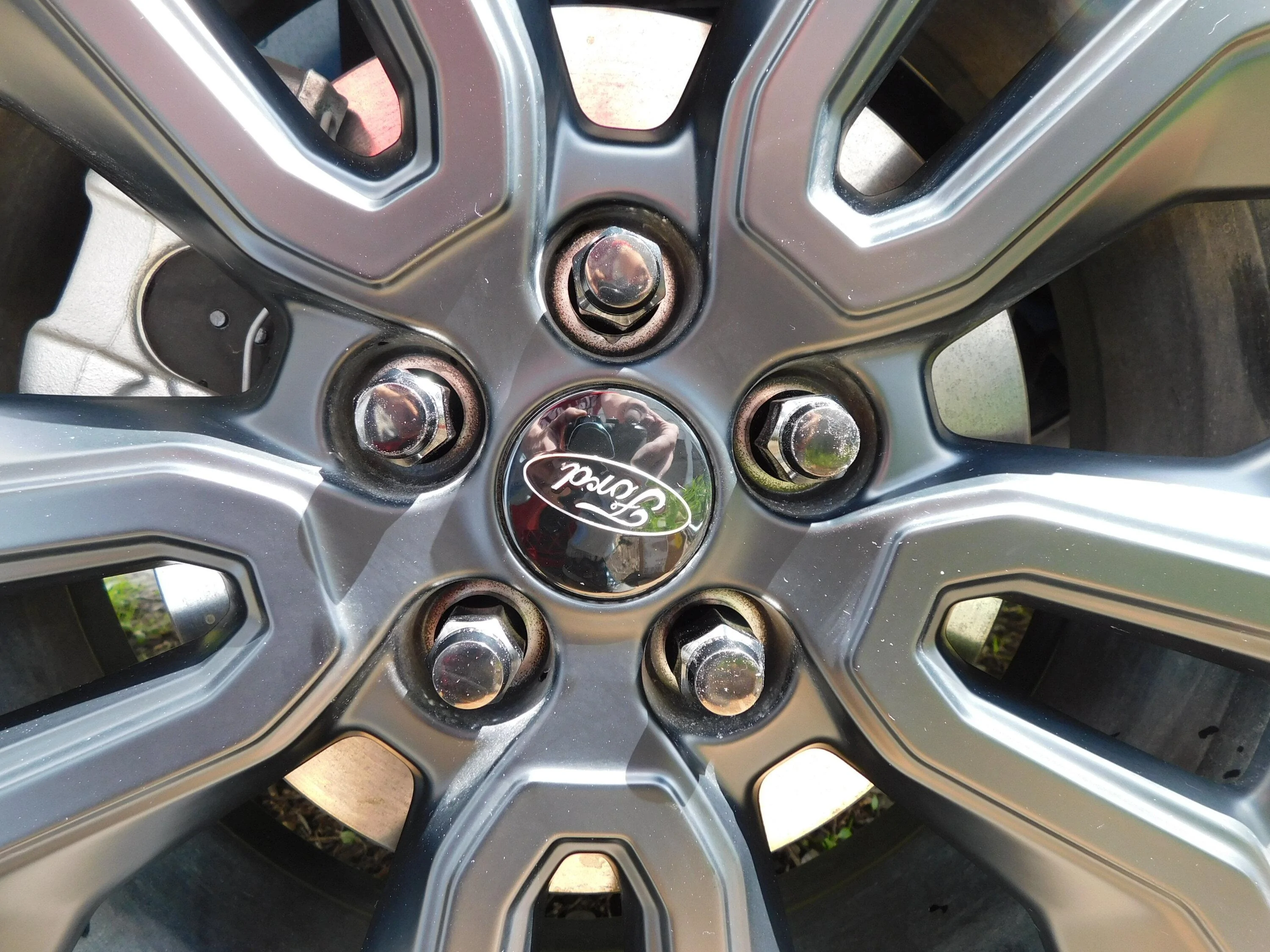 Ford Maverick I replaced the two piece stock lug nuts with one piece black lug nuts. blk lugs no paint