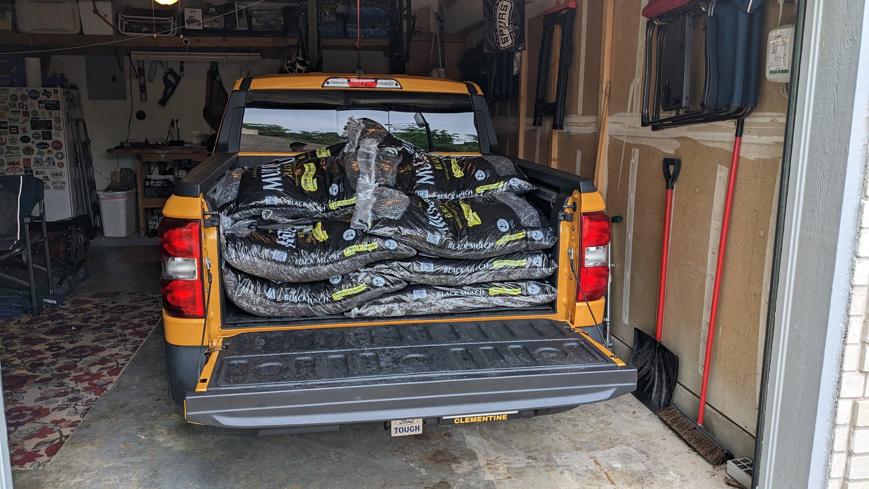 Ford Maverick Hybrid hauling and towing mulch PXL_20230403_142926229