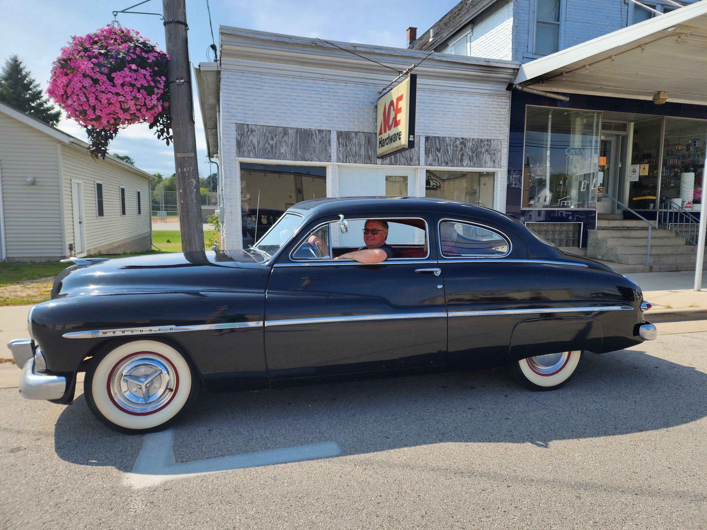 Ford Maverick Whitewall Era mercury in front of store