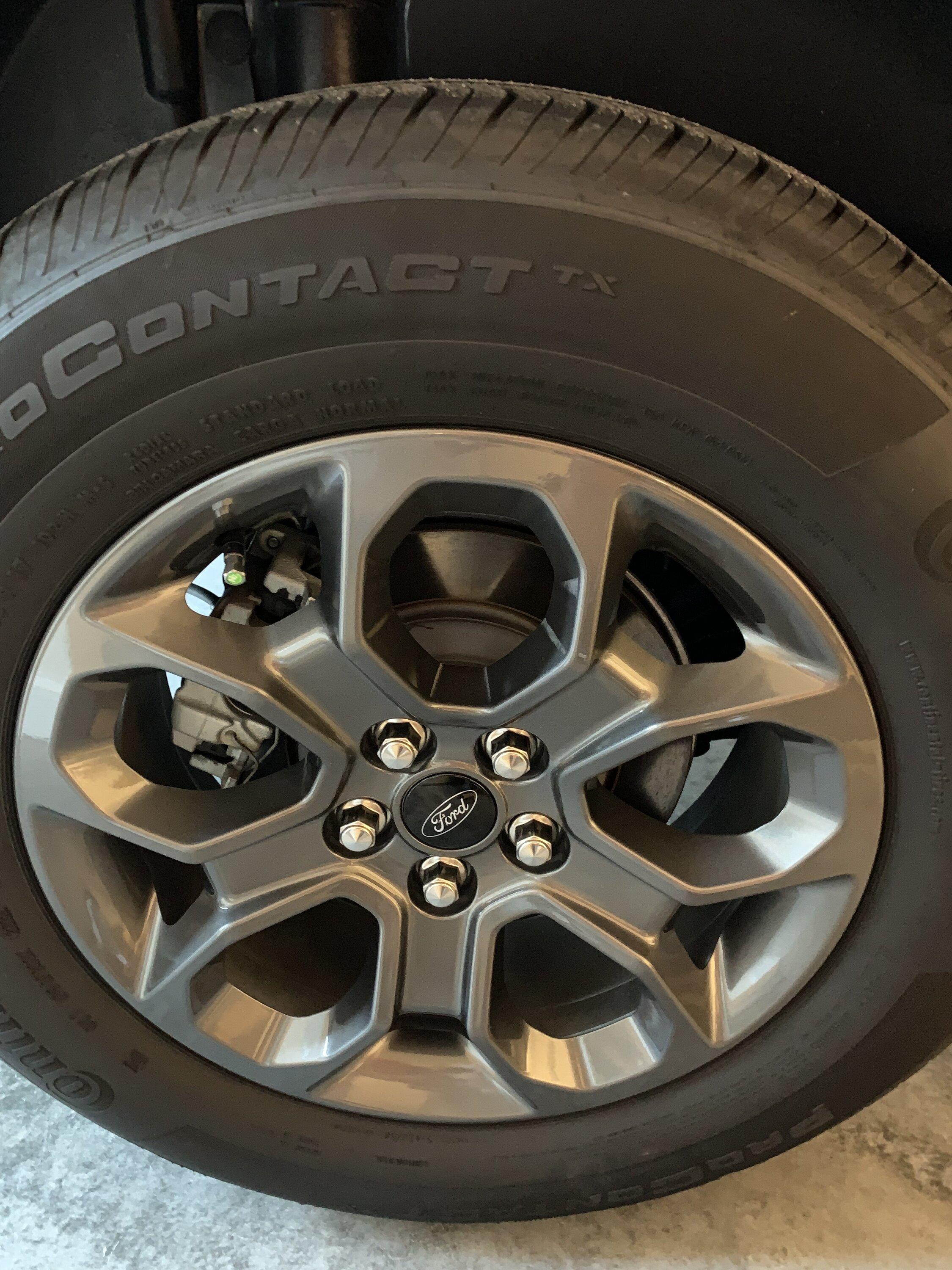 Ford Maverick Matte black lug nuts to replace OEM lugs IMG_1679