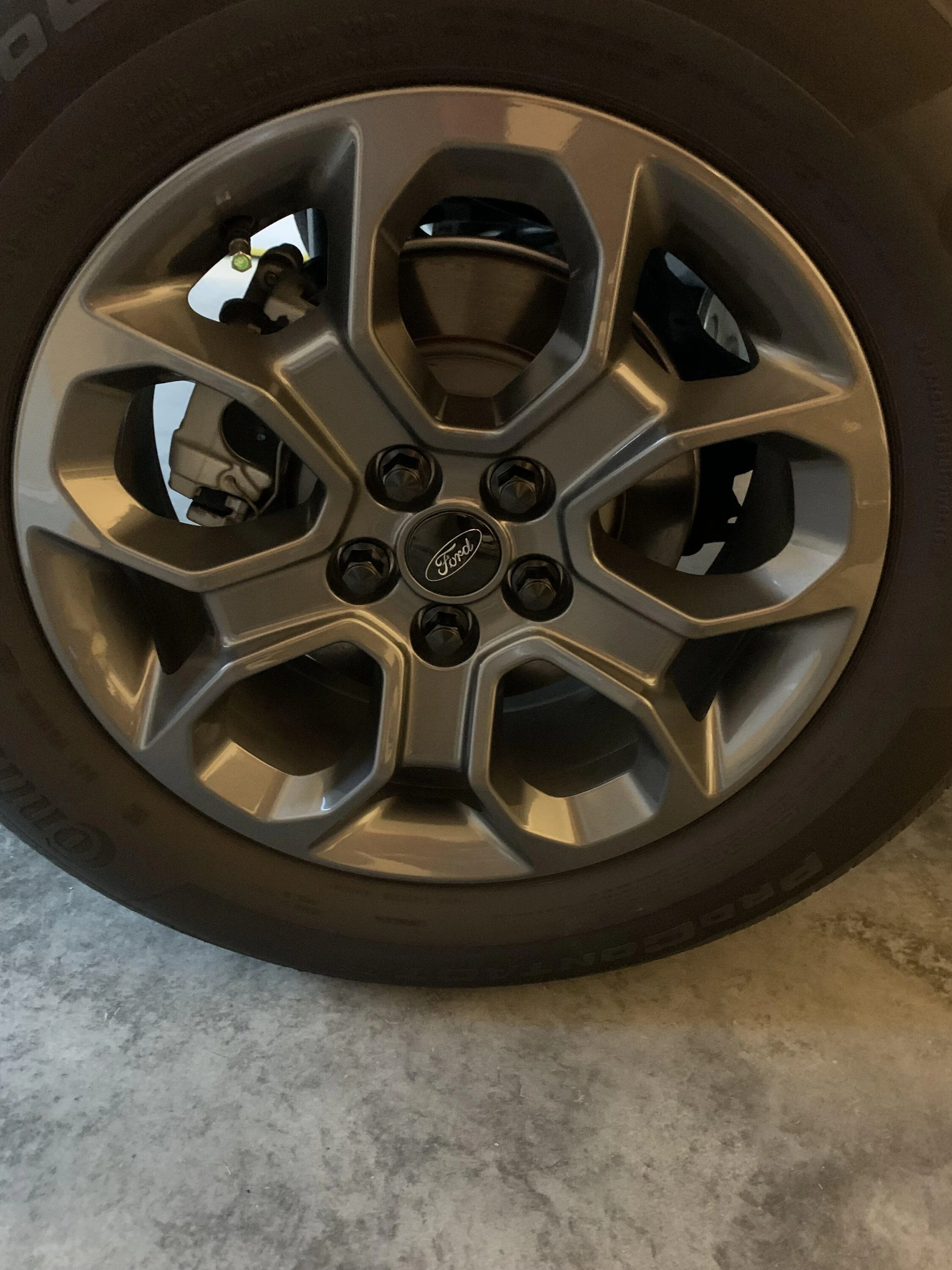 Ford Maverick Matte black lug nuts to replace OEM lugs IMG_1680