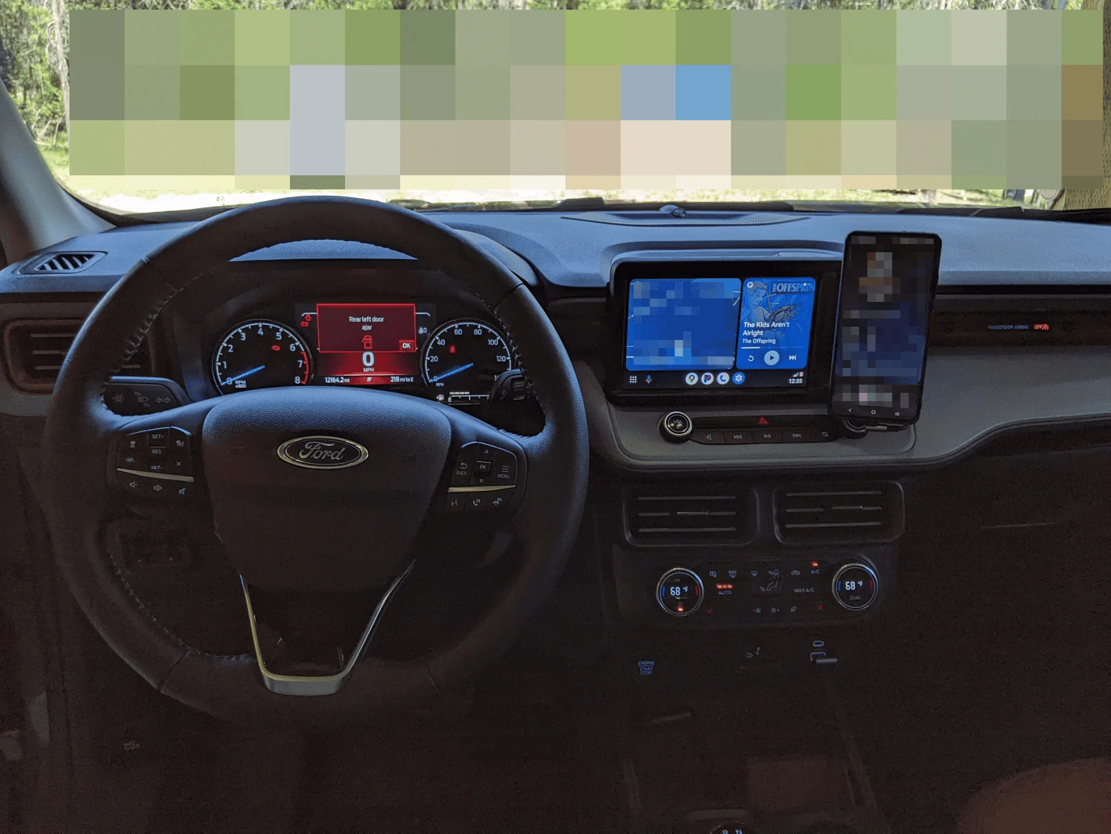 Ford Maverick Anyone have a solid cubby solution for holding phone with case? 1000001070