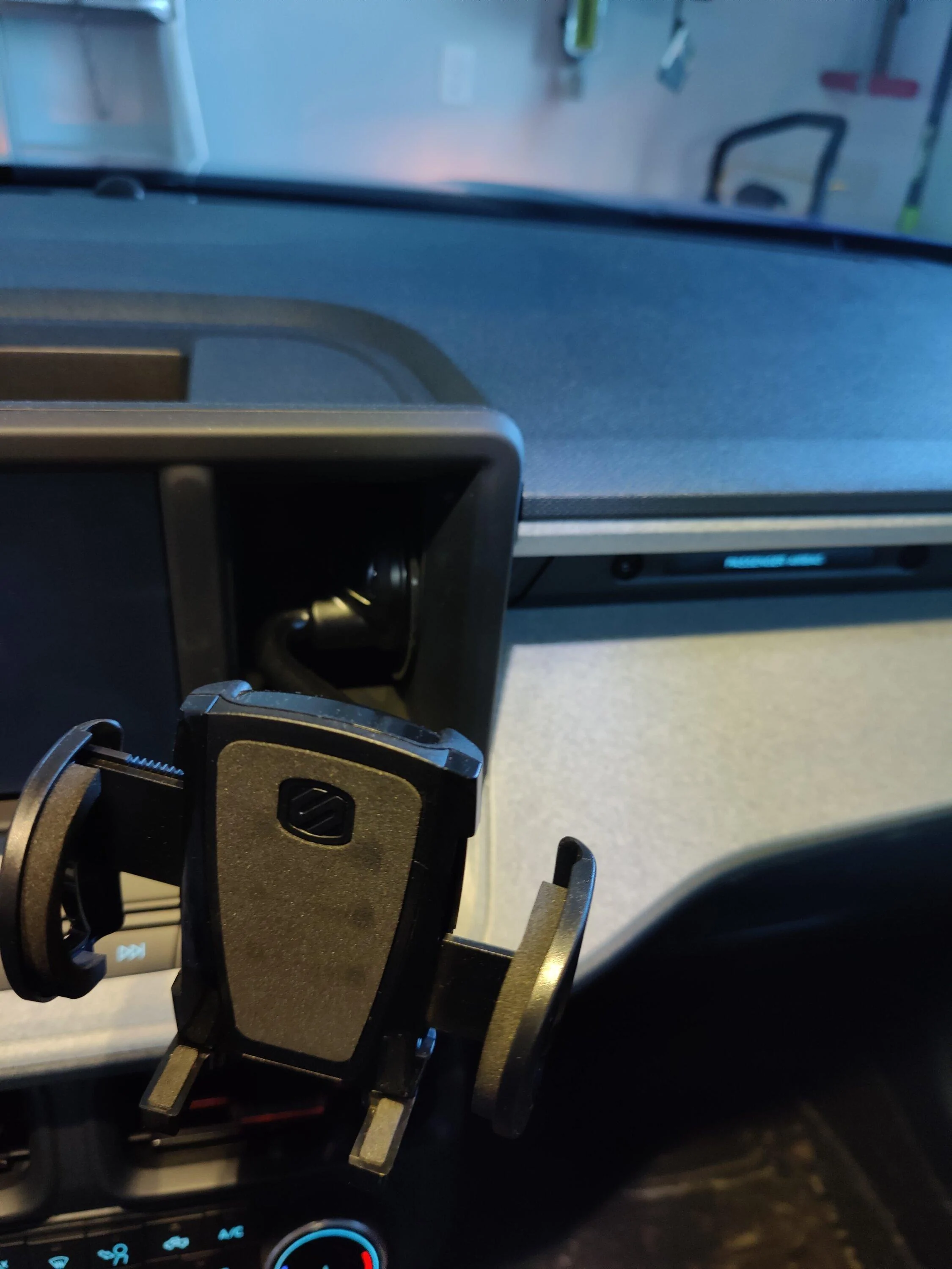 Ford Maverick Anyone have a solid cubby solution for holding phone with case? 17080352607188378403510766410232