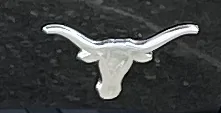 Ford Maverick Opinions on this Maverick emblem?  The cow in lower right bottom side of tailgate. fugly