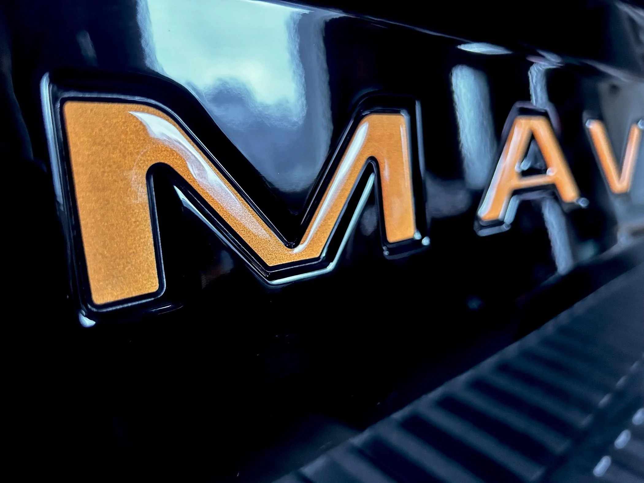 Ford Maverick Tailgate Lettering in Tremor Orange (on black Maverick) IMG_1855