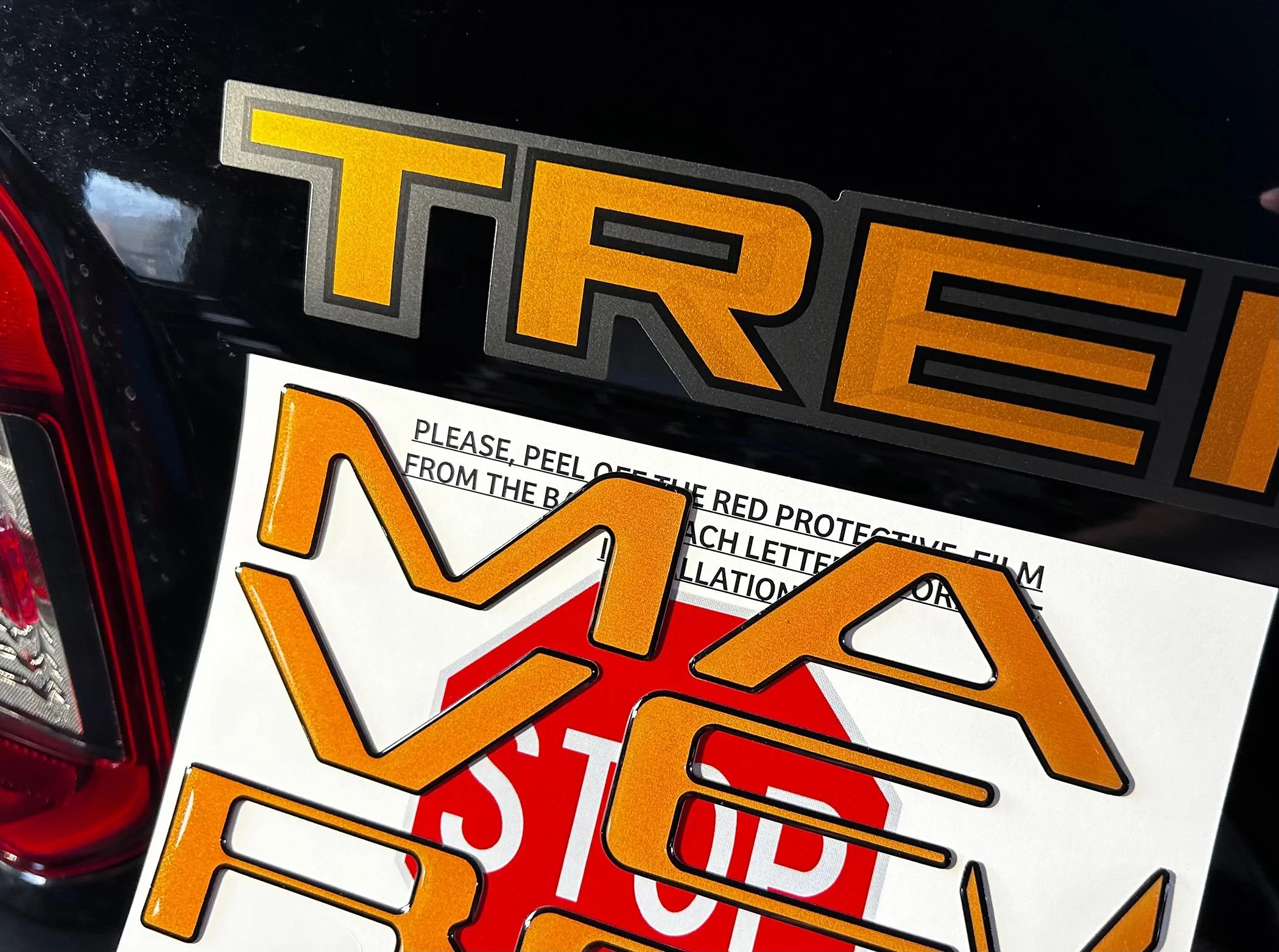 Ford Maverick Tailgate Lettering in Tremor Orange (on black Maverick) IMG_1850
