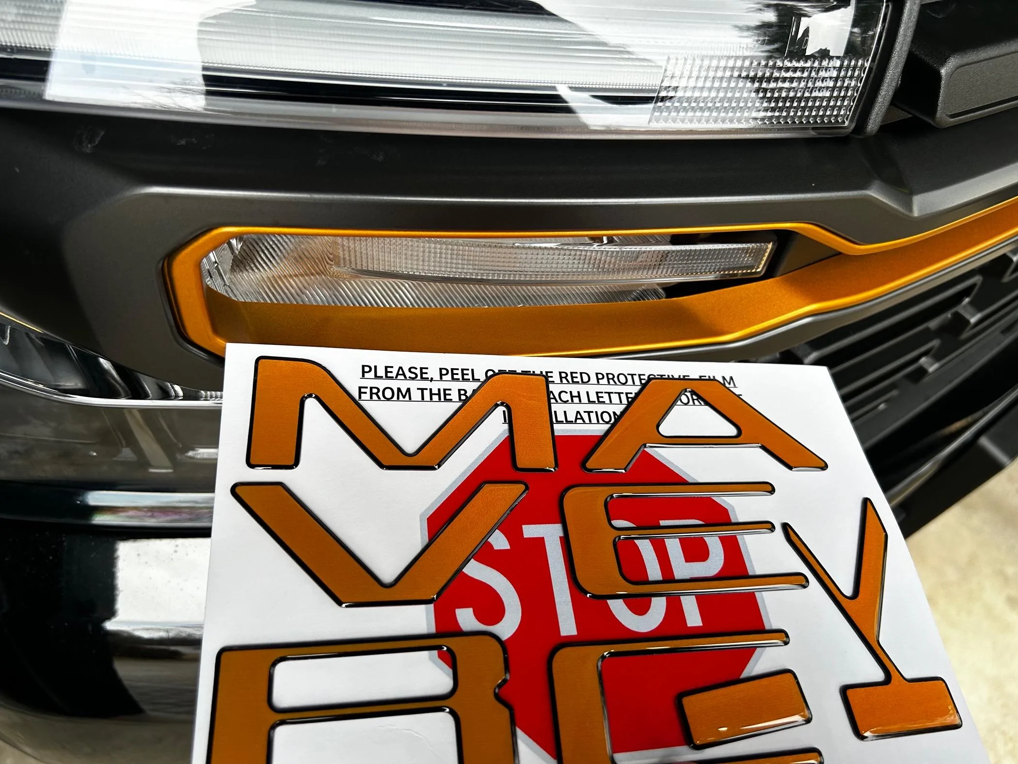 Ford Maverick Tailgate Lettering in Tremor Orange (on black Maverick) IMG_1851