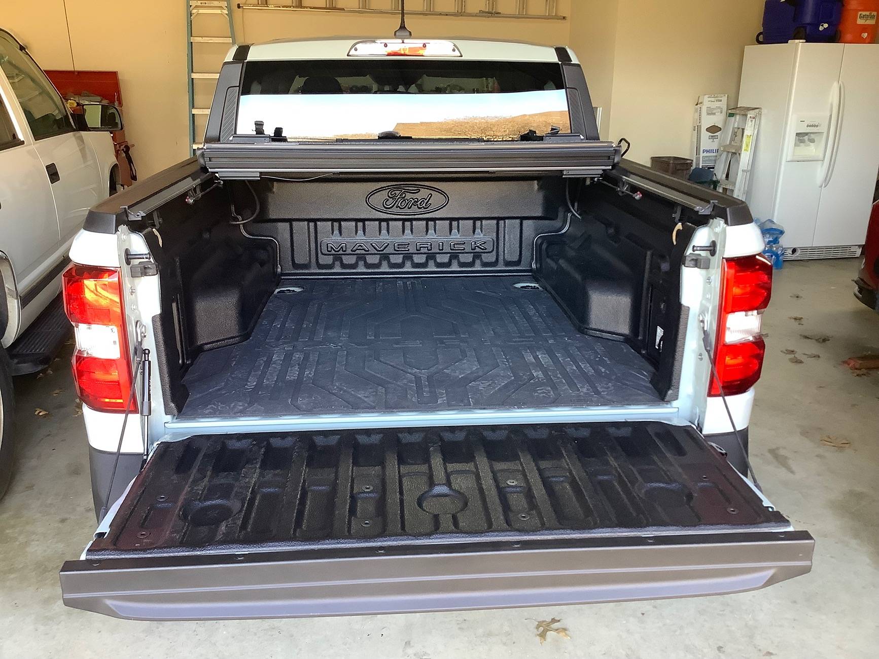 Ford Maverick Replaced "factory" drop in bed liner tray and Tailgate with bedrug IMG_1229