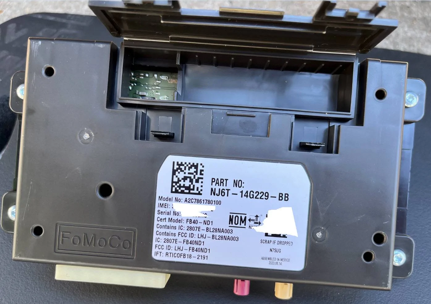 Ford Maverick how to remove telemetric control module TCU w Empty Battery Compartment
