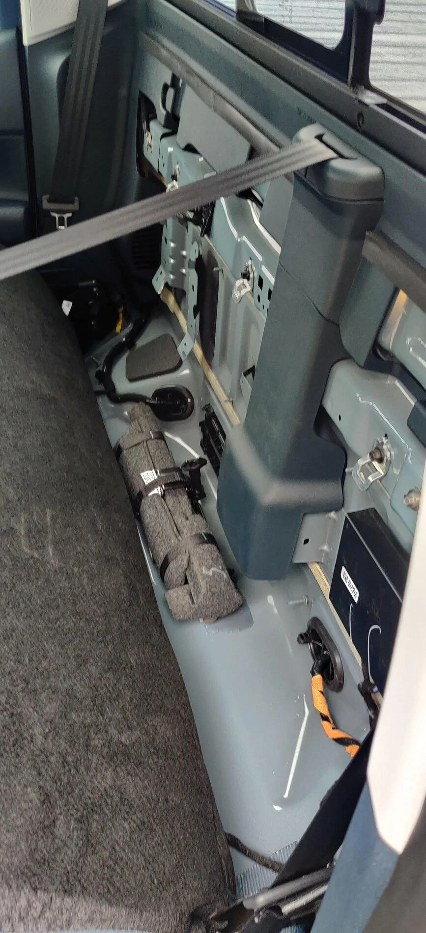 Ford Maverick Could subwoofer under the seat damage battery? Maverick under bench seat storage bin compartment 2