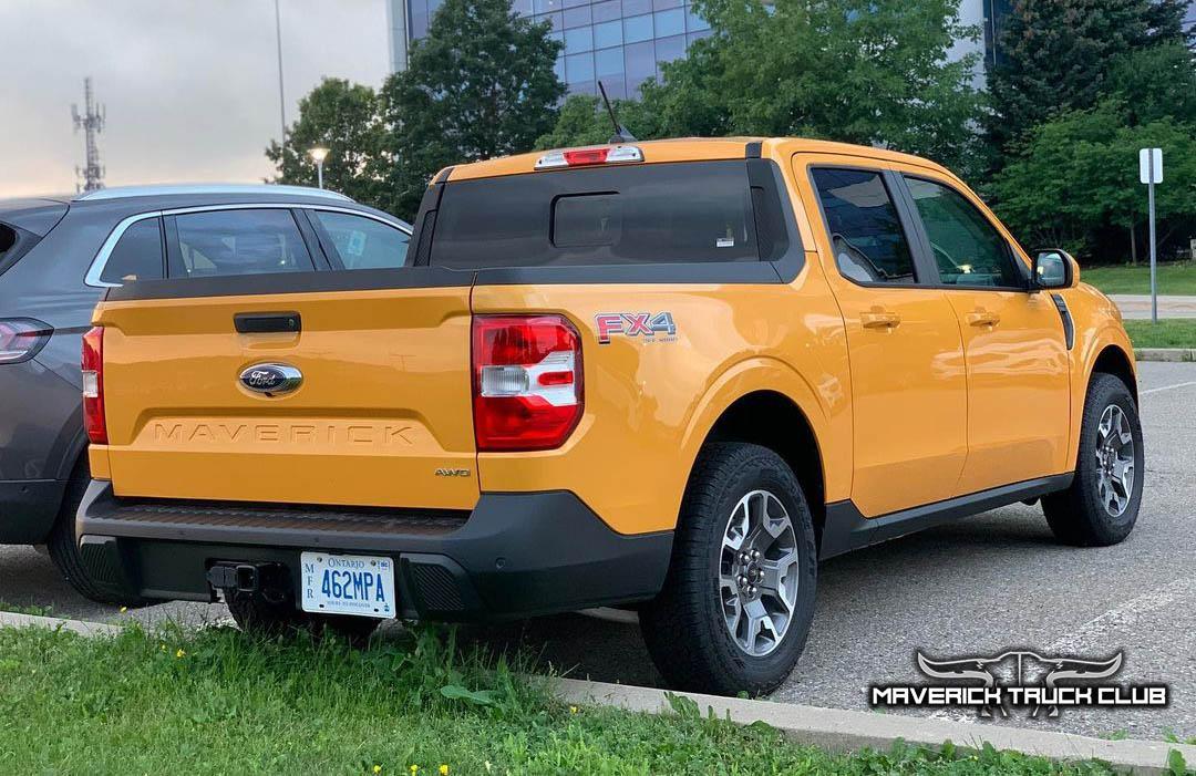 Ford Maverick Best Looks Yet at 2022 Maverick in Cyber Orange [Lariat FX4]. Front License Plate Holder Shown Cyber Orange 2022 Maverick Lariat FX4  Rear
