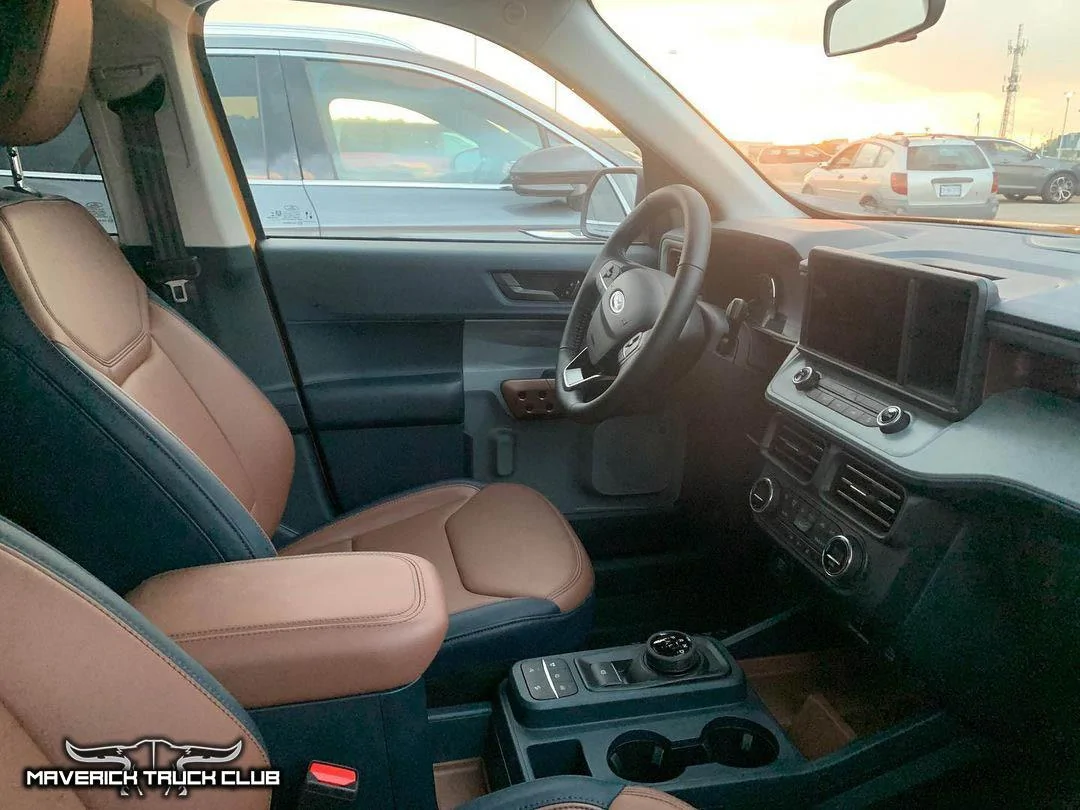 Ford Maverick Best Looks Yet at 2022 Maverick in Cyber Orange [Lariat FX4]. Front License Plate Holder Shown Cyber Orange 2022 Maverick Lariat FX4 3