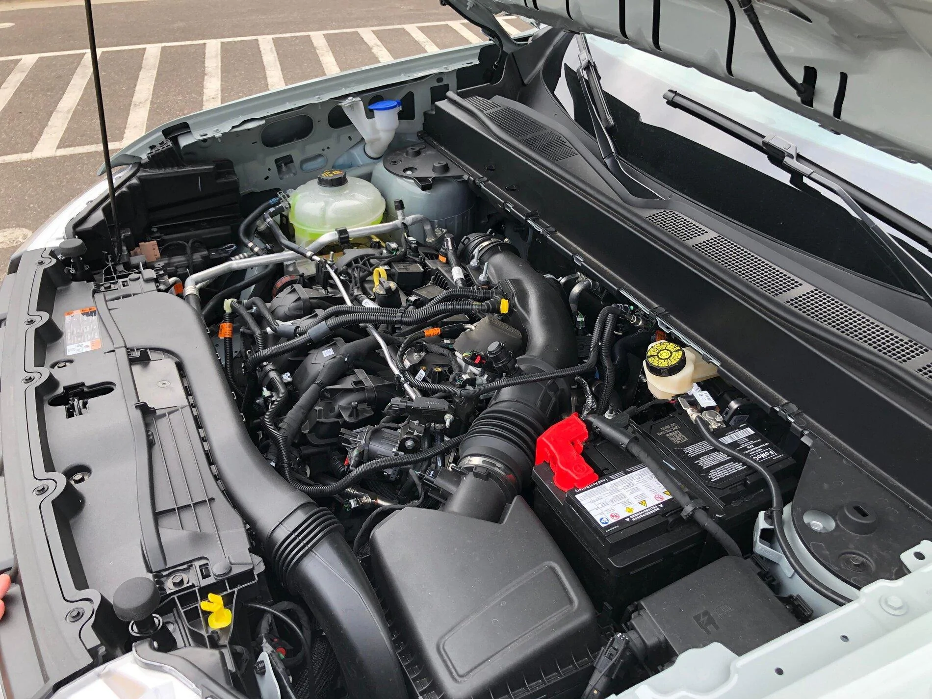 Ford Maverick Pics: Maverick Lariat in Cactus Gray - Next to F150, Interior, Engine Compartment, Spare Tire, Undercarriage 2022 Maverick 2.0L engine underhood engine compartment 3