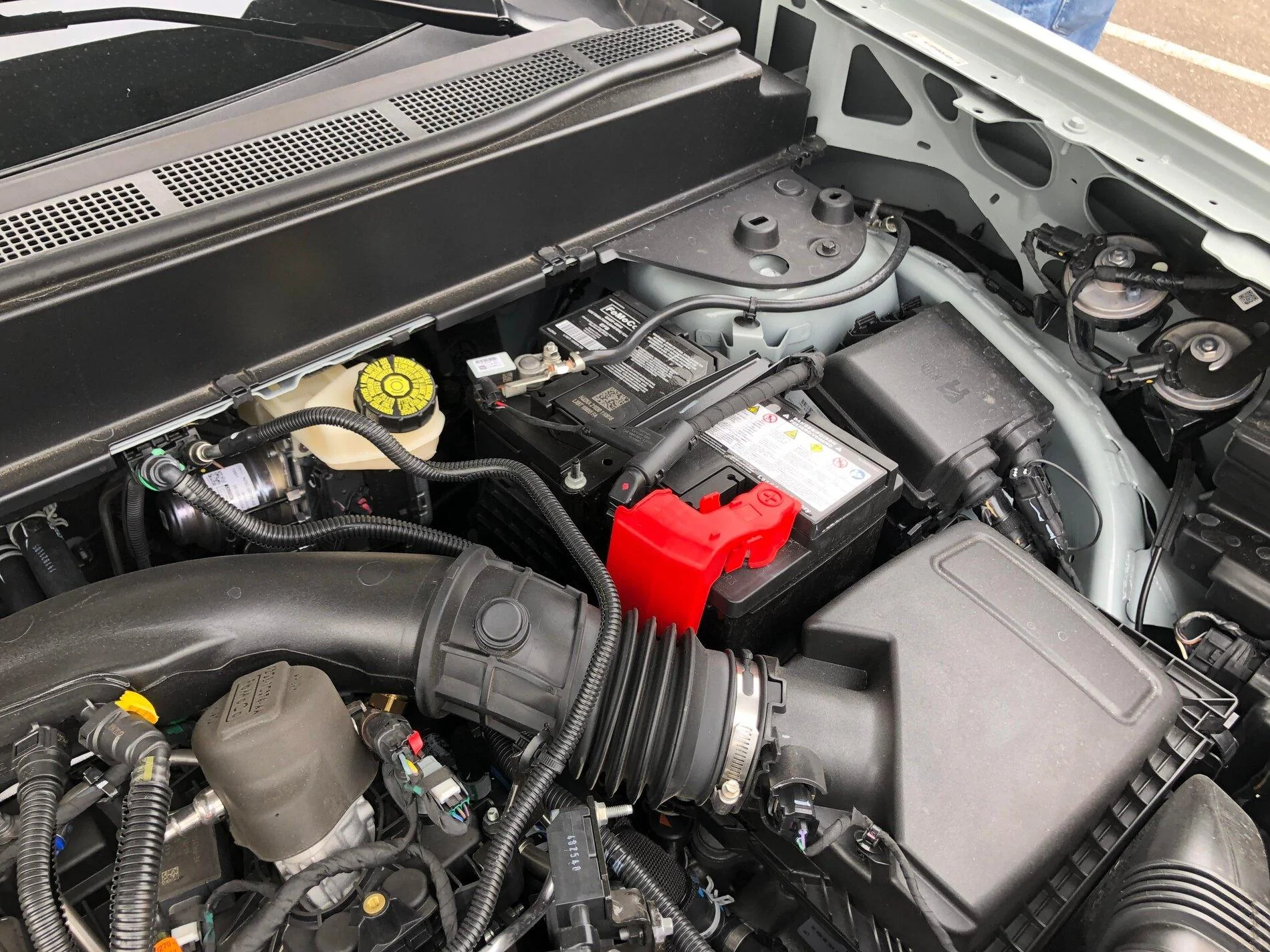 Ford Maverick Pics: Maverick Lariat in Cactus Gray - Next to F150, Interior, Engine Compartment, Spare Tire, Undercarriage 2022 Maverick 2.0L engine underhood engine compartment 2