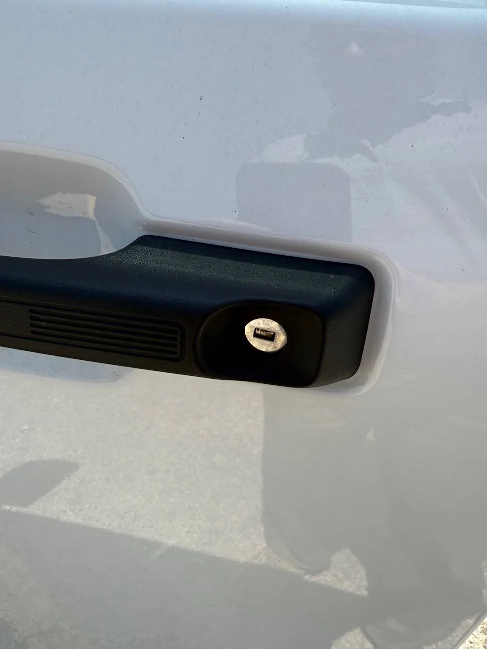 Ford Maverick Driver door handle keyhole cover "button" IMG_2520