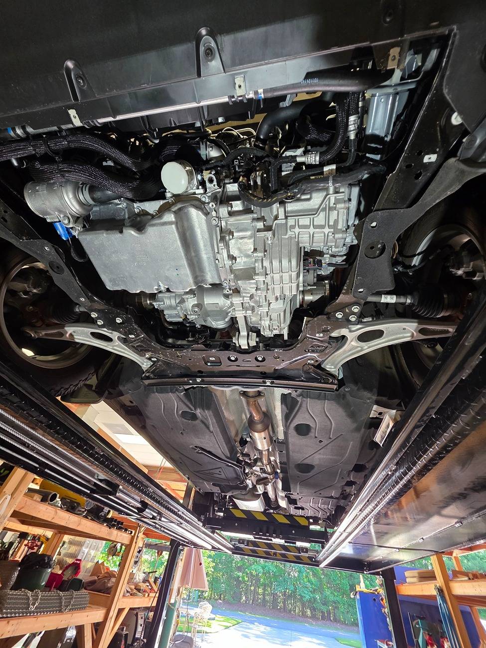 Ford Maverick 2025 Hybrid AWD underside pictures. Whole drivetrain wide angle