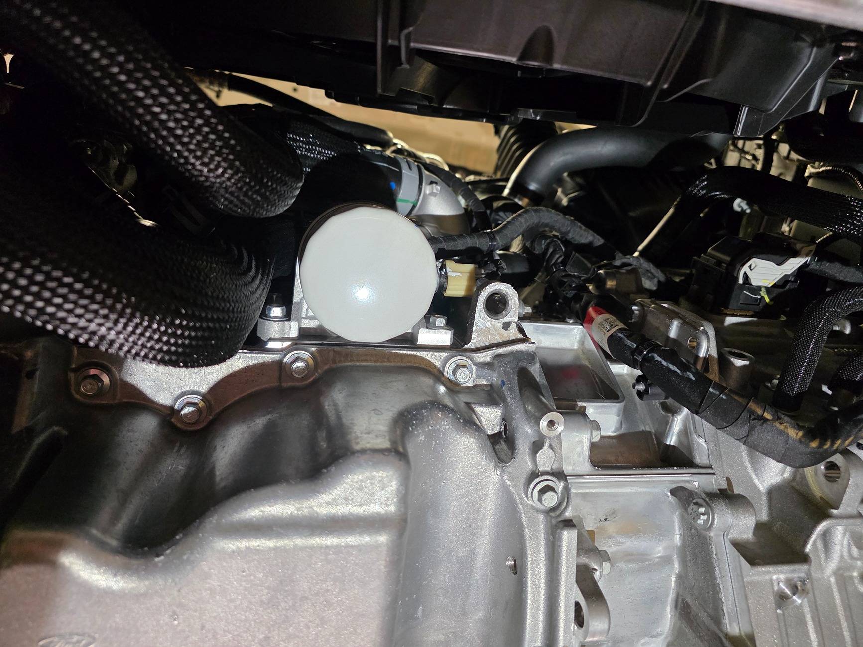 Ford Maverick 2025 Hybrid AWD underside pictures. Oil filter looking strait u
