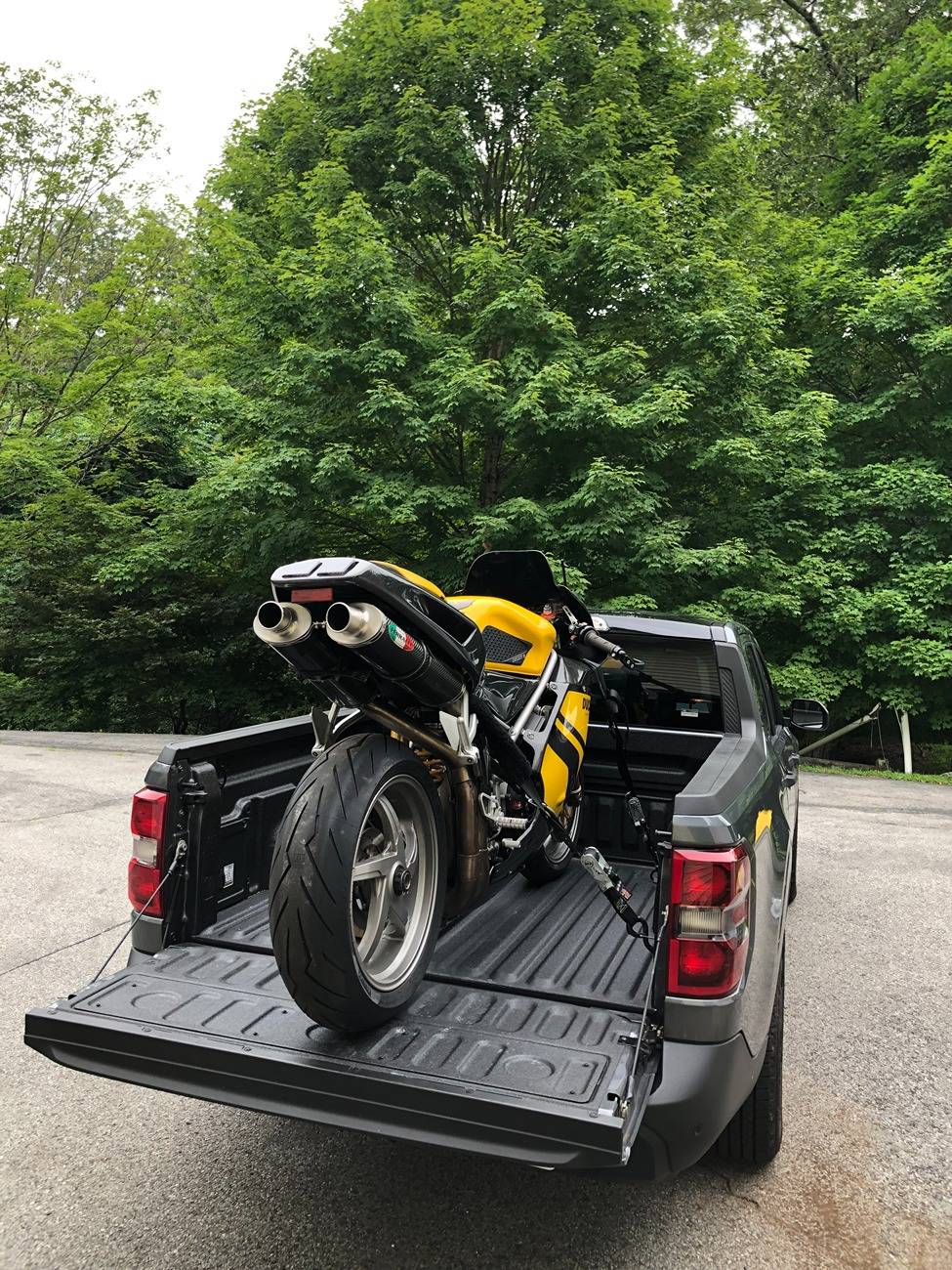 Ford Maverick 2 Motorcycles in back of bed Maverick _ DUC rear