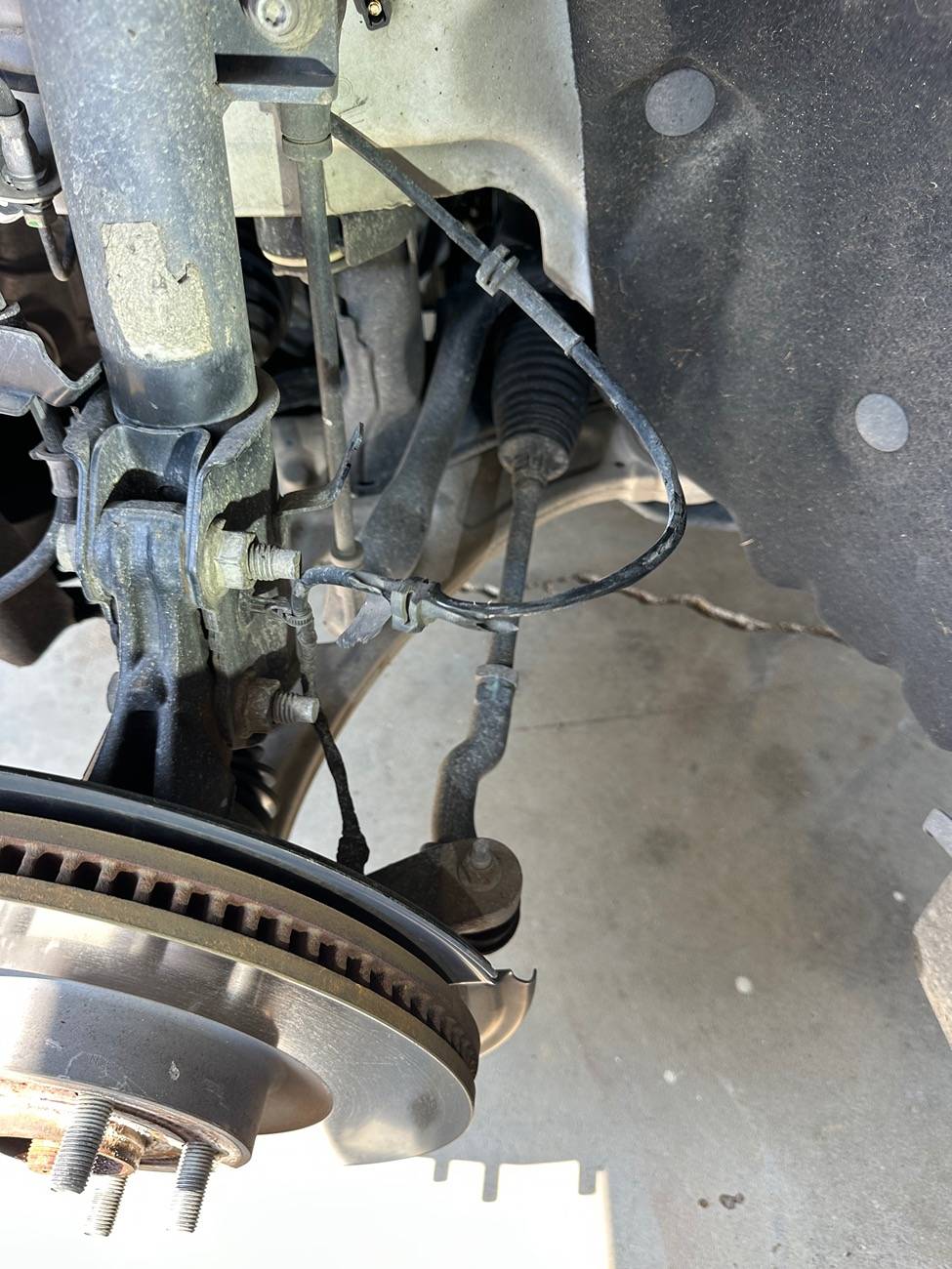 Ford Maverick Cable Rubbing in Wheel Well Causing Clicking Sound While Driving. Anyone Else? IMG_7715