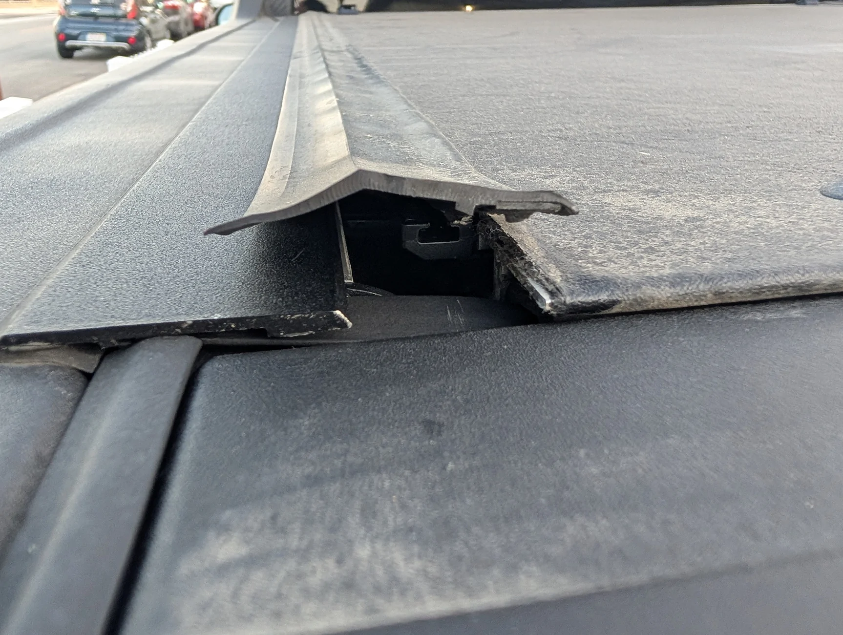 Ford Maverick Ford REV roll-up tonneau cover is peeling back PXL_20250817_022100397