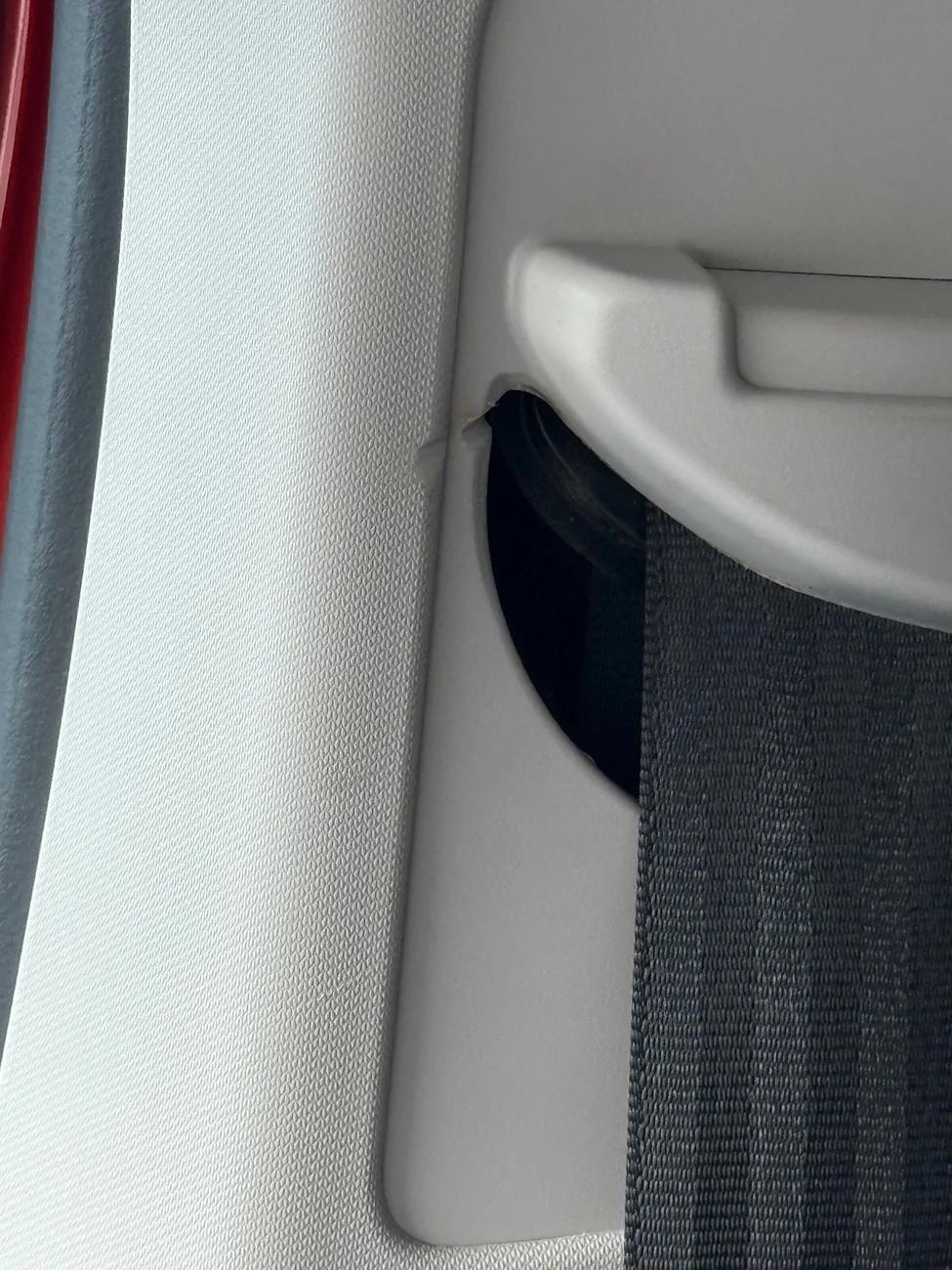Ford Maverick Seatbelt is sawing through plastic trim surround IMG_6021