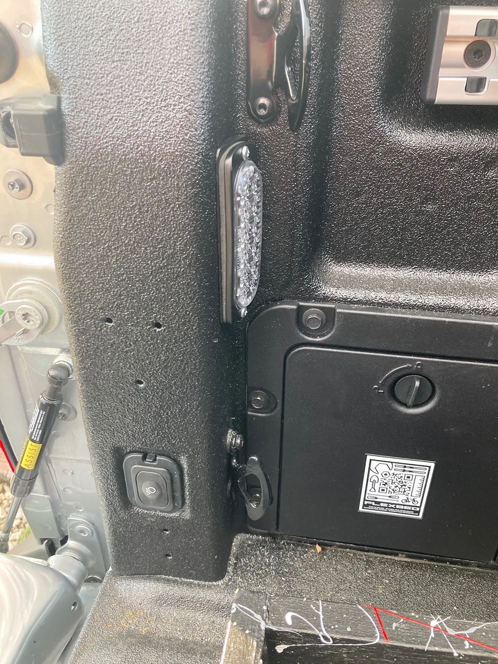 Ford Maverick Driver's side bed cubby with AC outlet on the inside IMG_8724