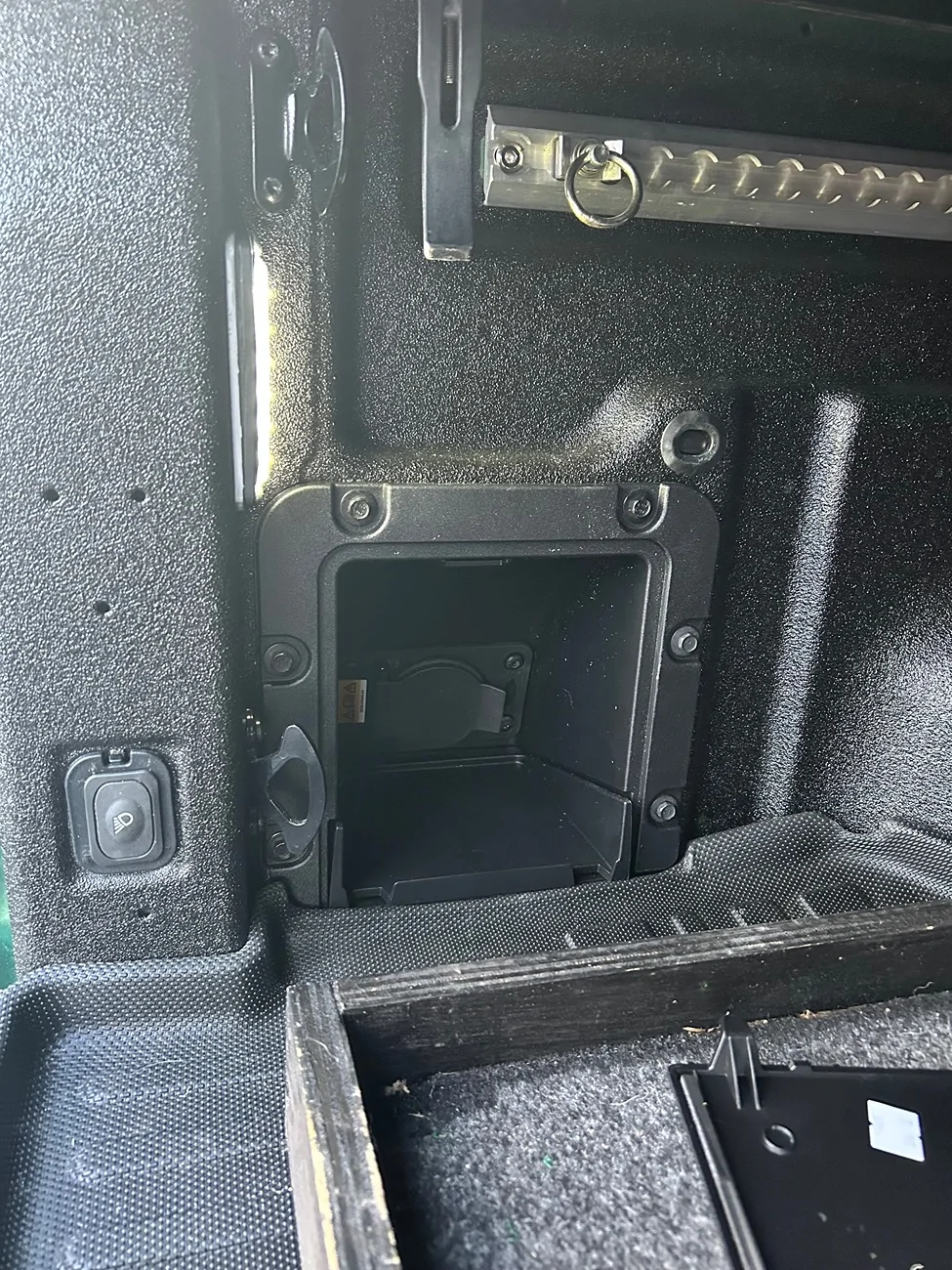 Ford Maverick Driver's side bed cubby with AC outlet on the inside IMG_1428
