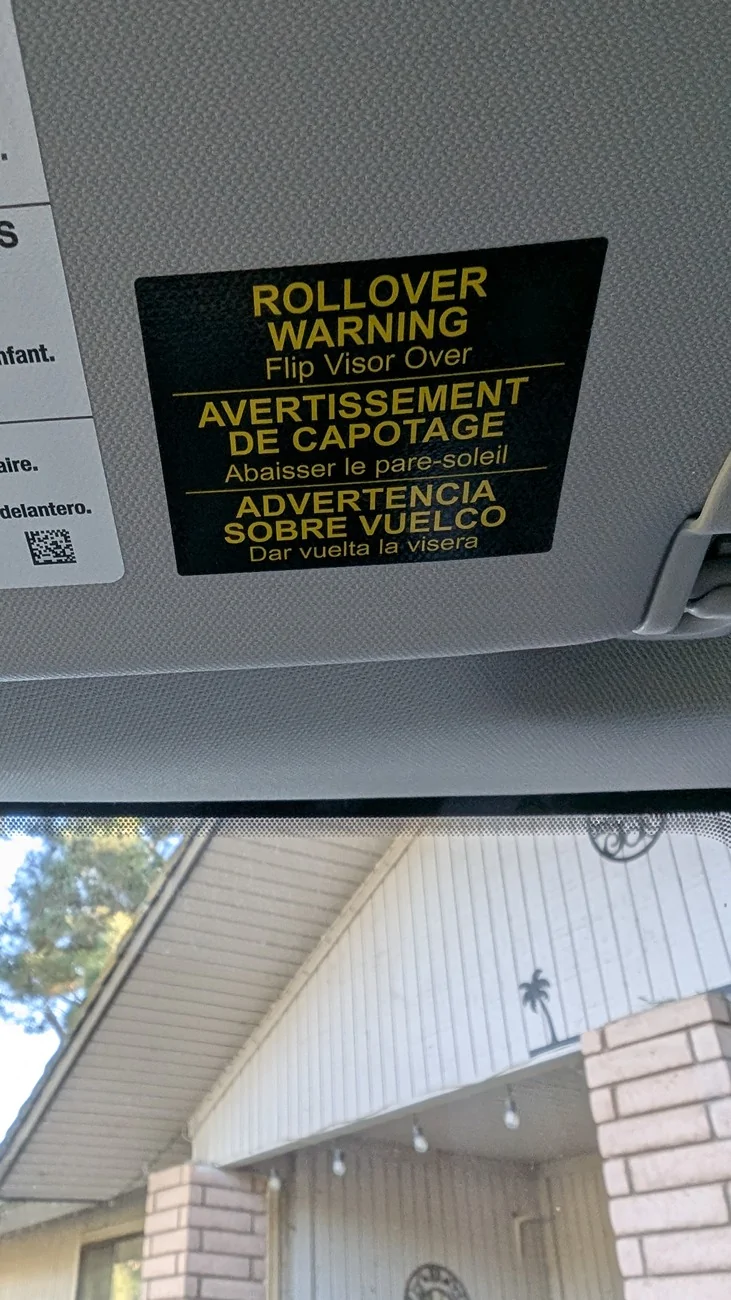 Ford Maverick Strange sticker on back of center rear view mirror PXL_20260127_231123640