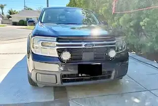 Ford Maverick Retro-look driving lights installed on grille 238497-0de4ab7540c4f3c6e6bcdf3810695a74
