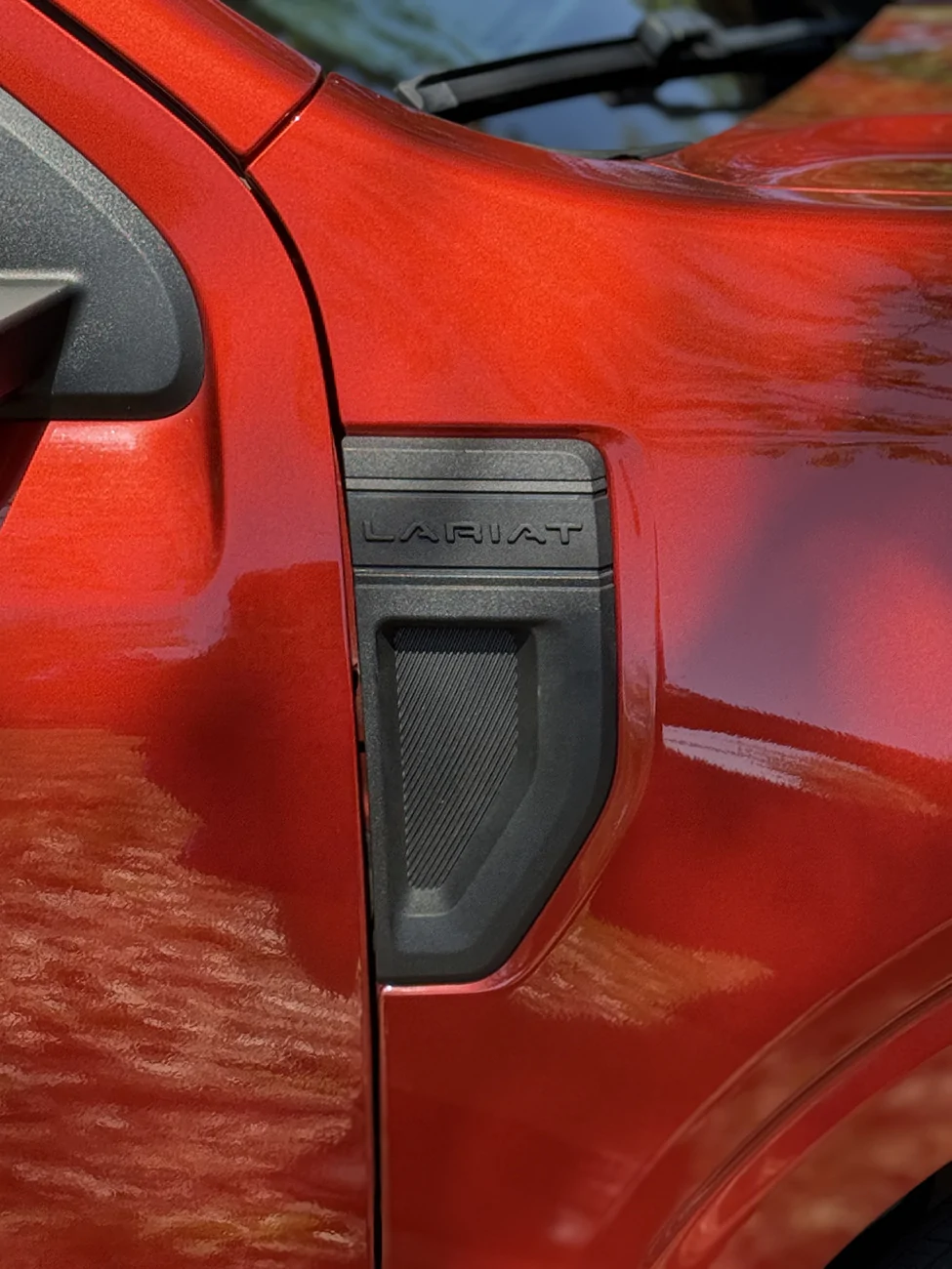 Ford Maverick Blacked-out Lariat side emblem. D2FLtDx