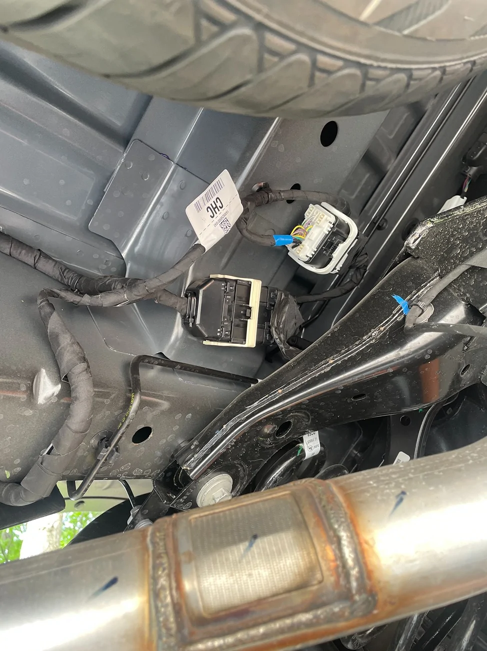 Ford Maverick Unprotected wiring harness under truck bed near the spring on the rear drivers side IMG_6599