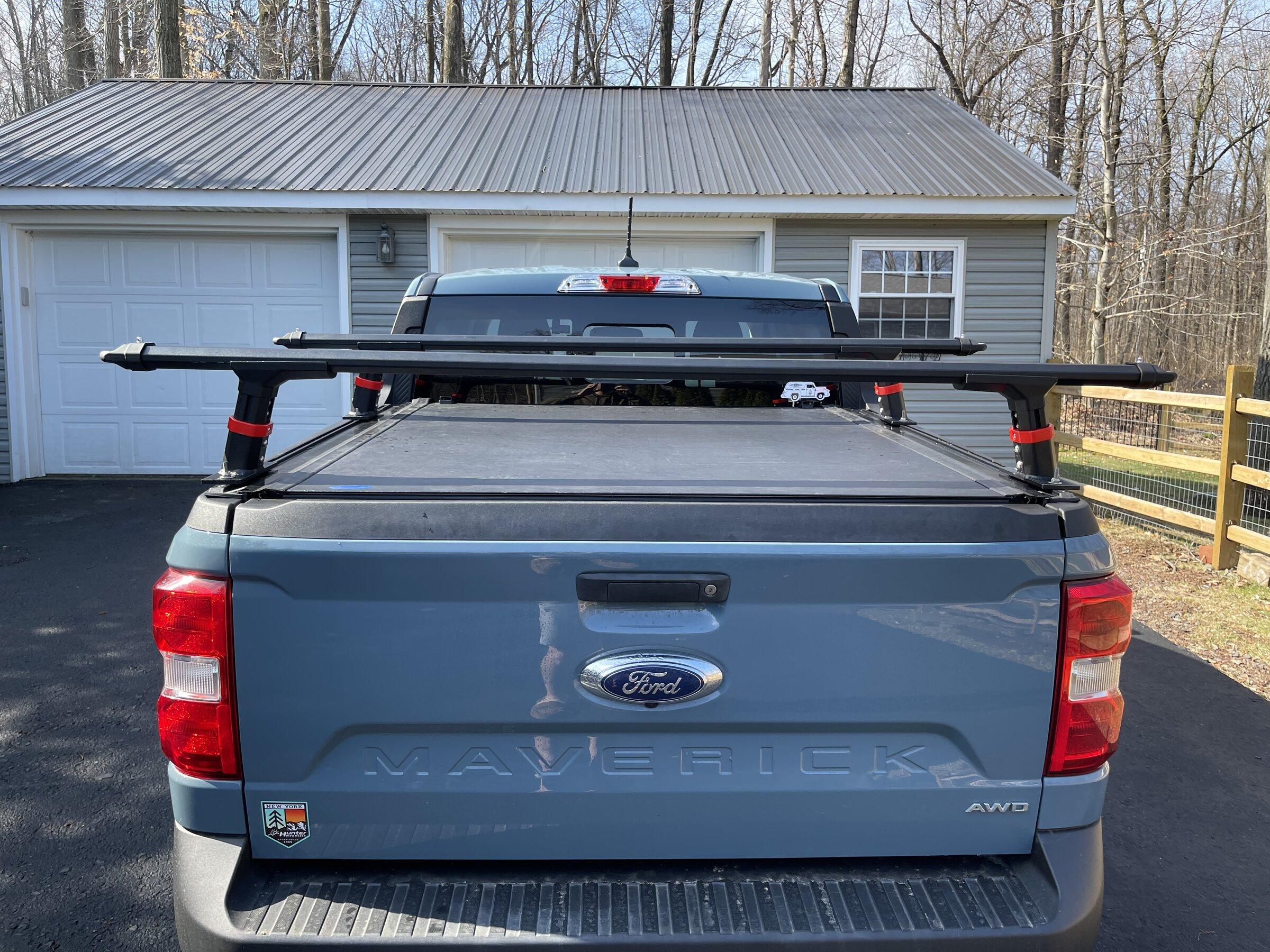 Ford Maverick Installed Medium Profile cross bars with Ford Accessories hard rollup 3972847A-90D7-42FB-9D3C-B6B00E25BEA5