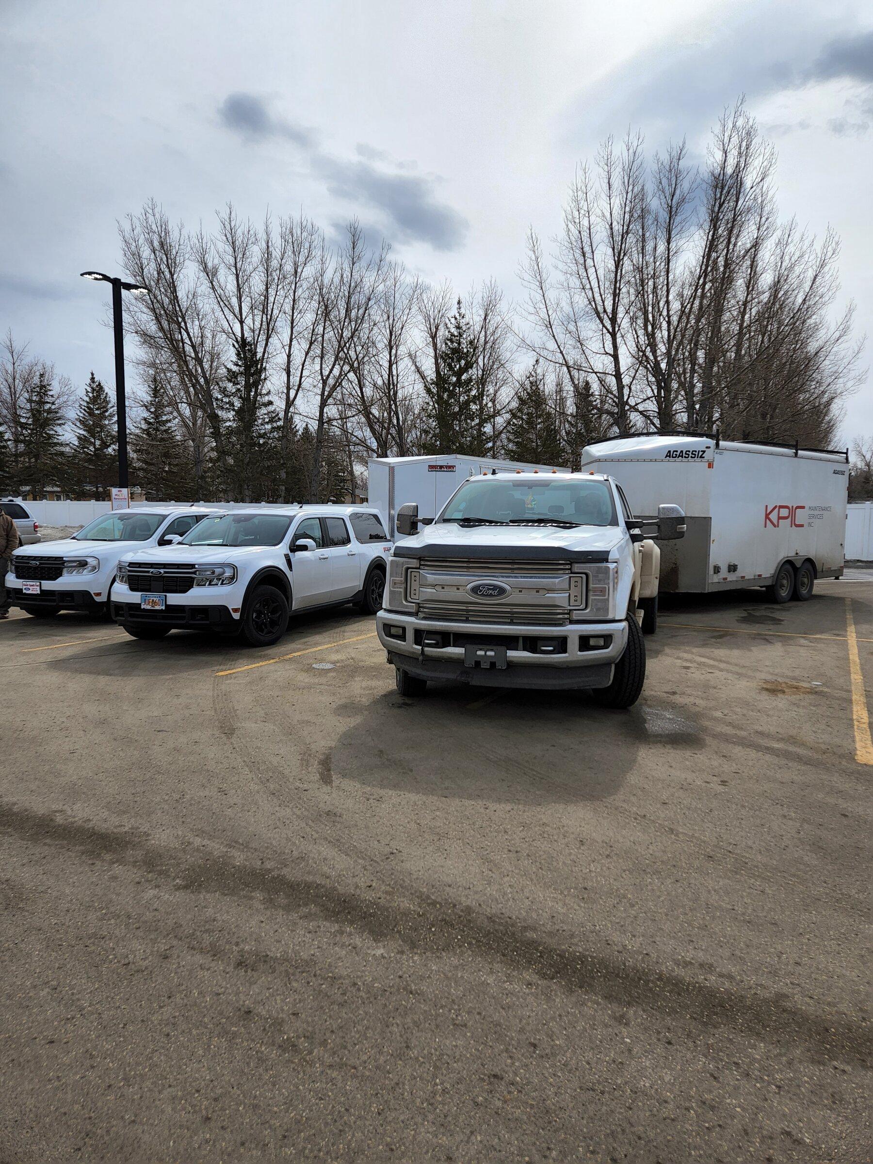 Ford Maverick Alaskan Bound - Delivery Road Trip Home in Two New Mavericks sizing up a F350 against Mavericks