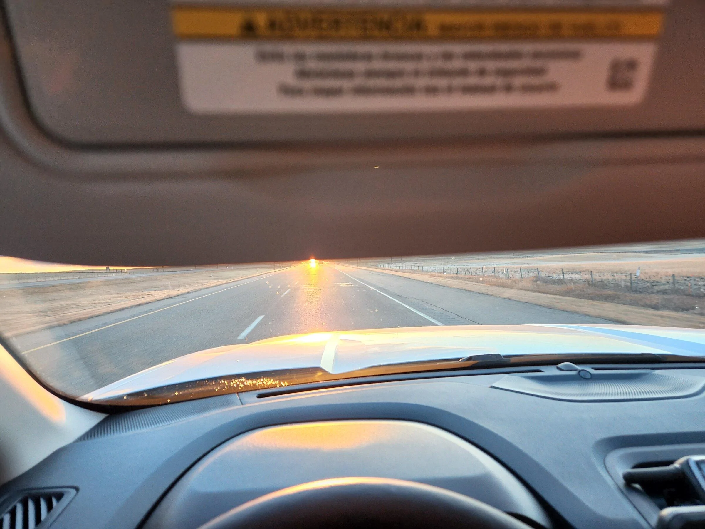 Ford Maverick Alaskan Bound - Delivery Road Trip Home in Two New Mavericks visor meeting Sunset