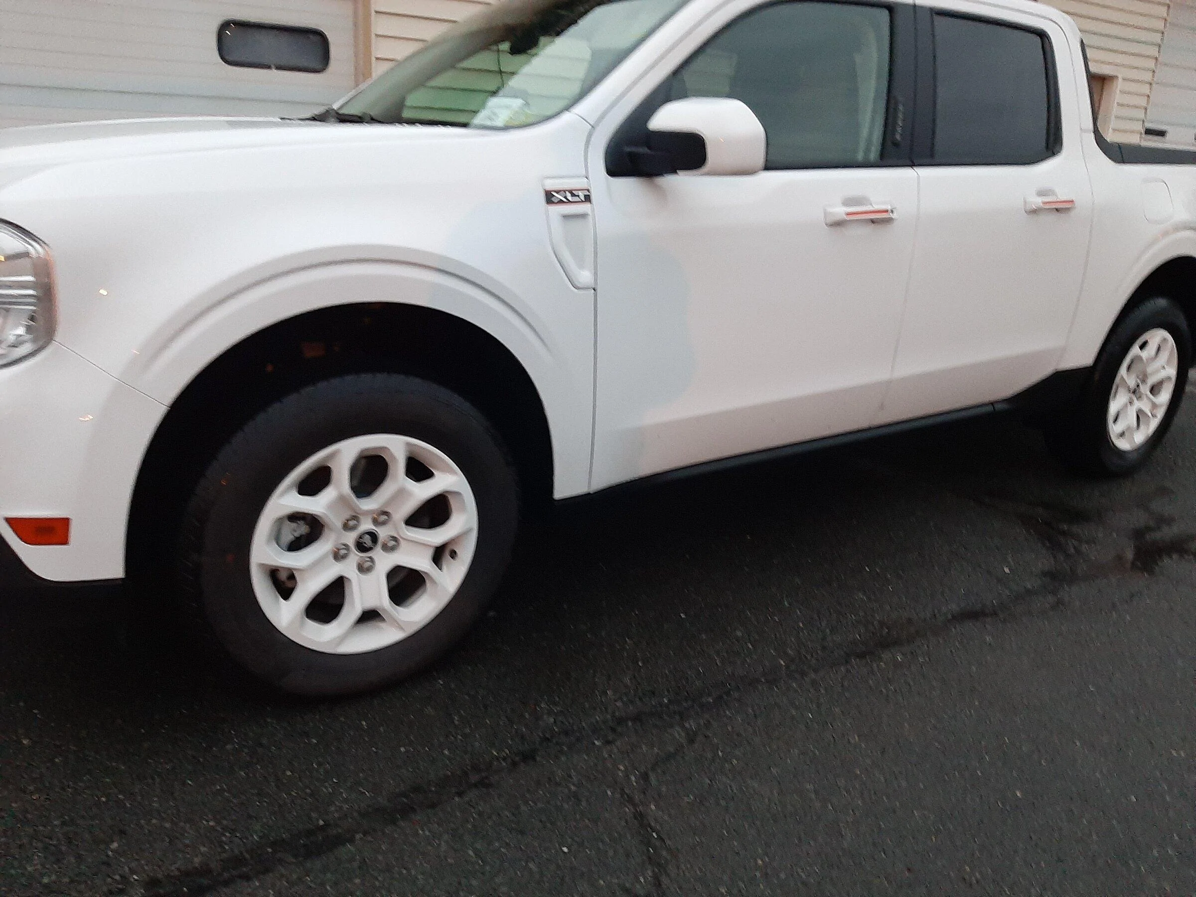 Ford Maverick My Maverick XLT w/ painted white wheels, stripes, aeroshield, raised lettering on the tailgate 20220412_062107