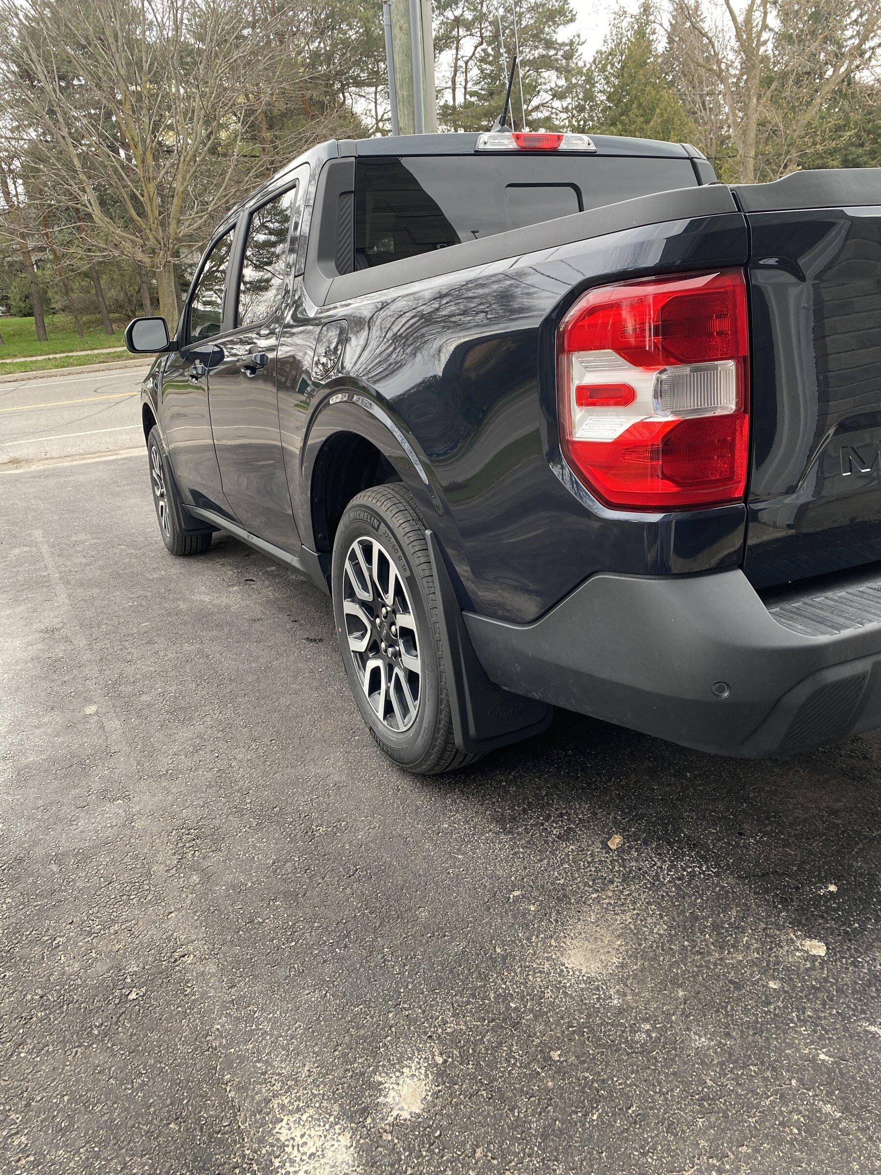Ford Maverick Ford mud flaps installed on Alto Blue Maverick 82E33DBC-3E96-44B8-927A-D18F10EBBC89