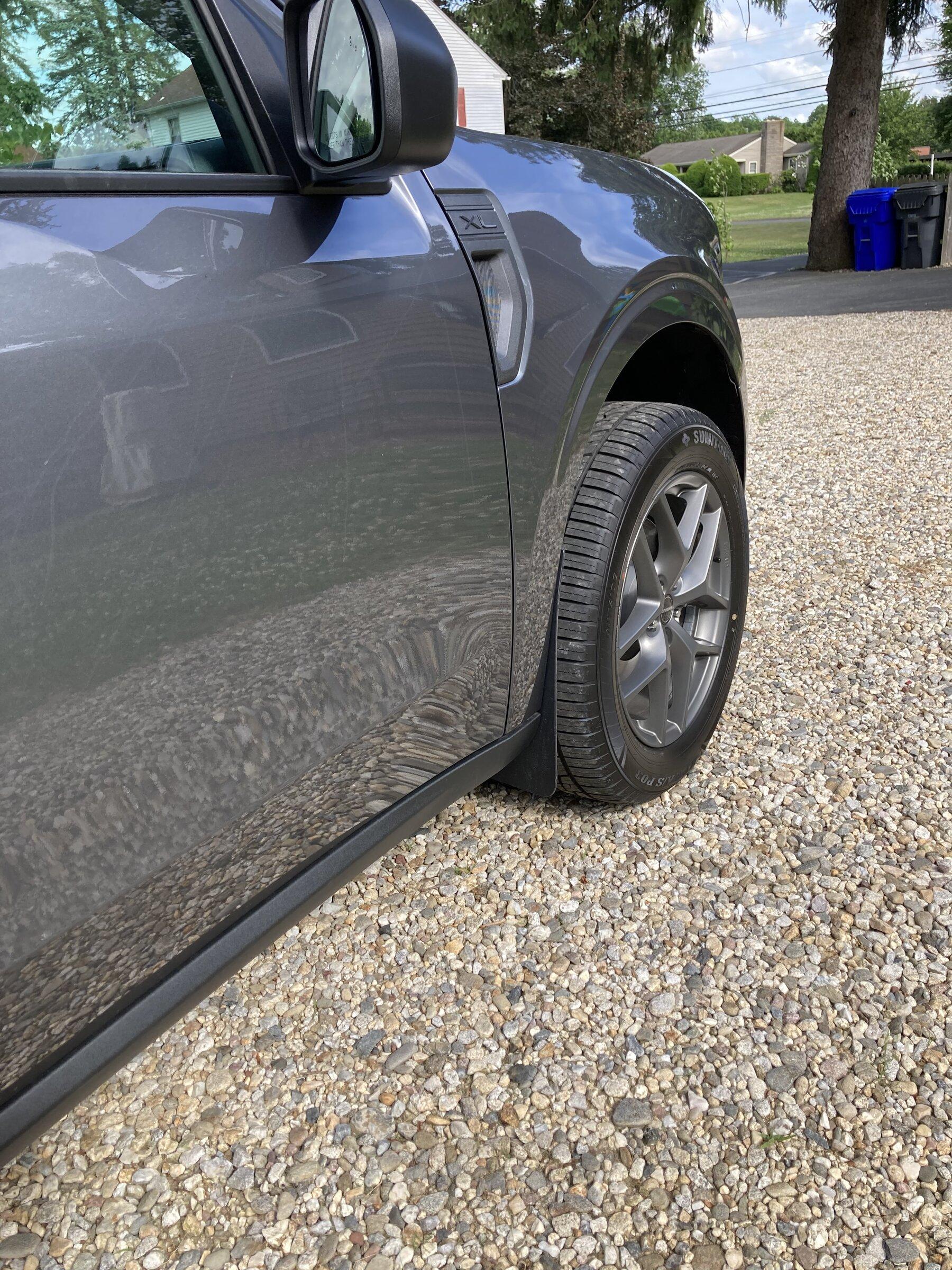 Ford Maverick Etrailer.com 9x15 Mud flaps installed IMG_0157.JPG