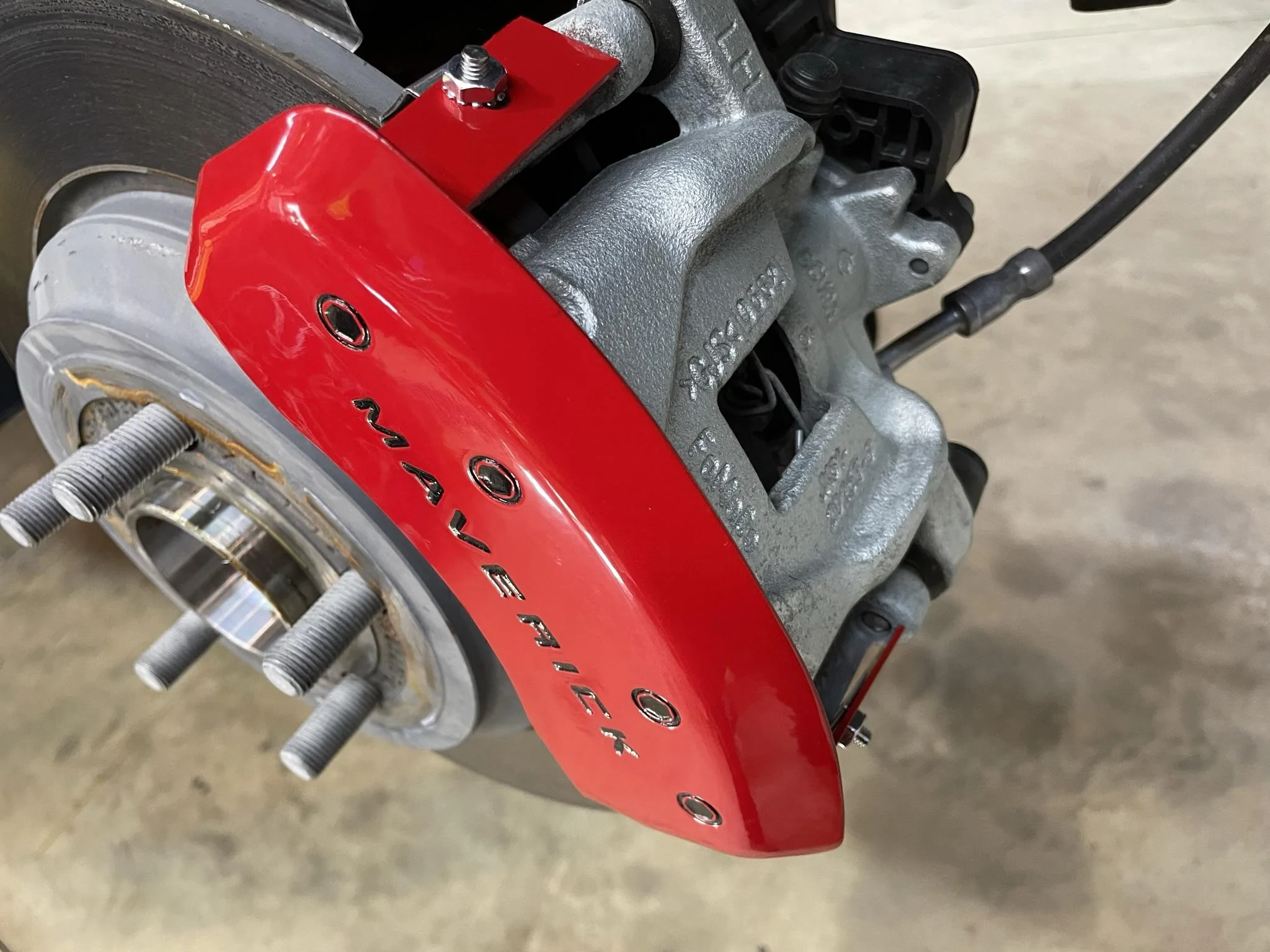 Ford Maverick Brake caliper covers from MGP Calipers installed 7EB556F3-AD2C-47B4-8DCC-01DB7178075A