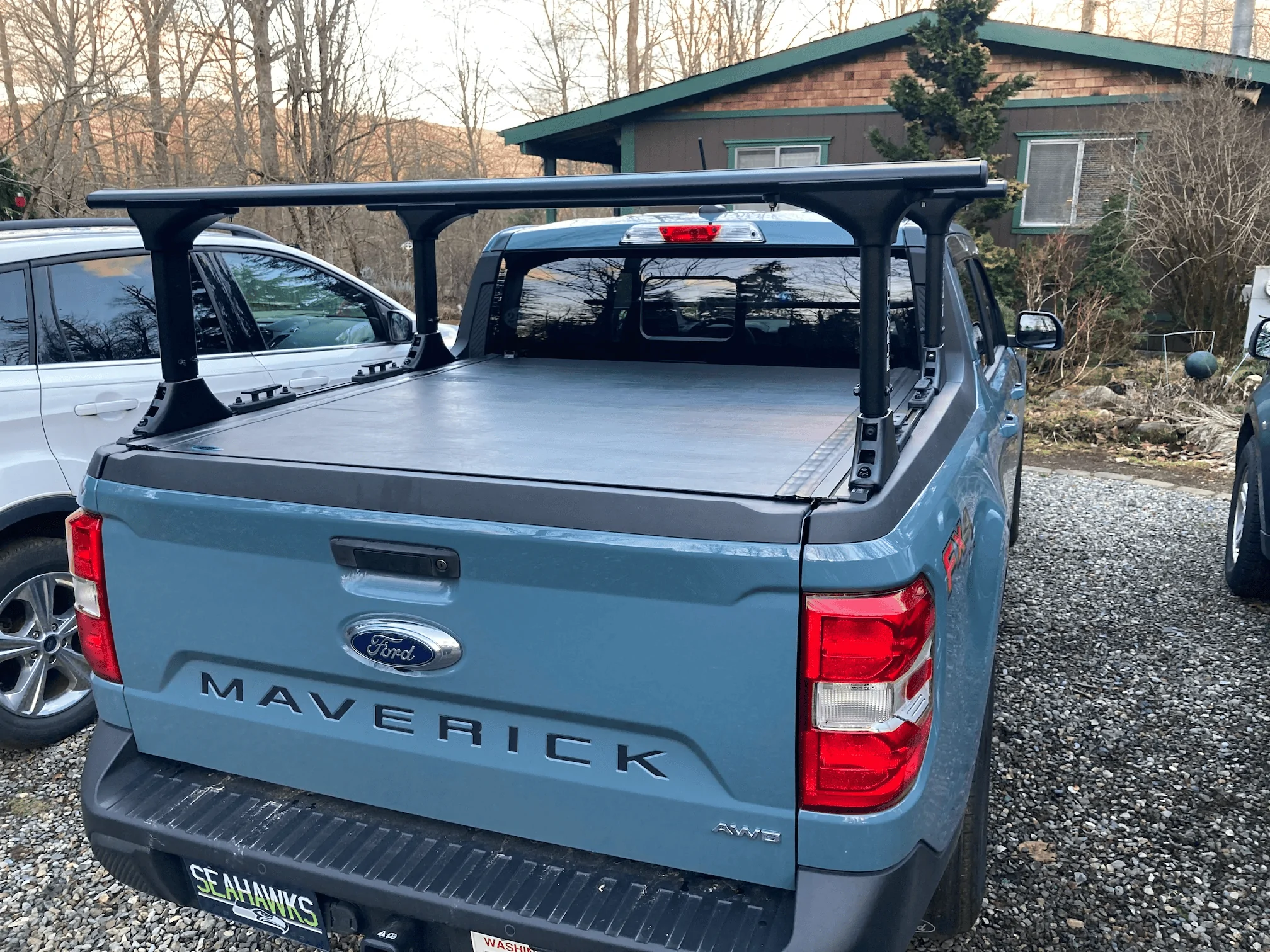 Ford Maverick Installed Elevate Racks, Ford Hard Roll-up Tonneau and Boeing airplane carpet rug 1676080825672