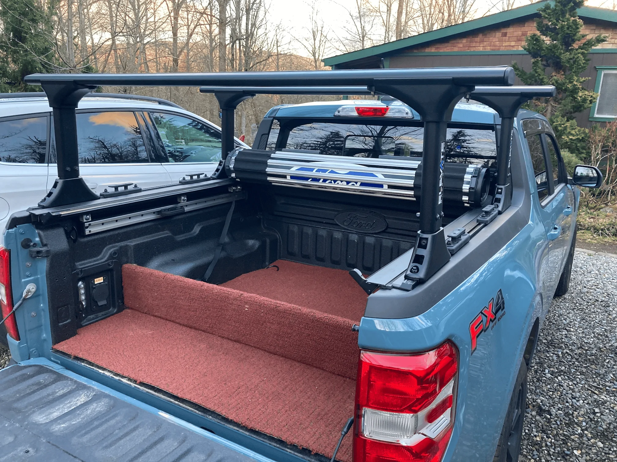 Ford Maverick Installed Elevate Racks, Ford Hard Roll-up Tonneau and Boeing airplane carpet rug 1676080883299