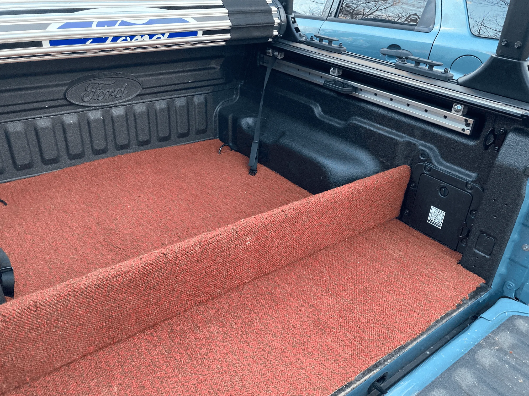 Ford Maverick Installed Elevate Racks, Ford Hard Roll-up Tonneau and Boeing airplane carpet rug 1676081085466