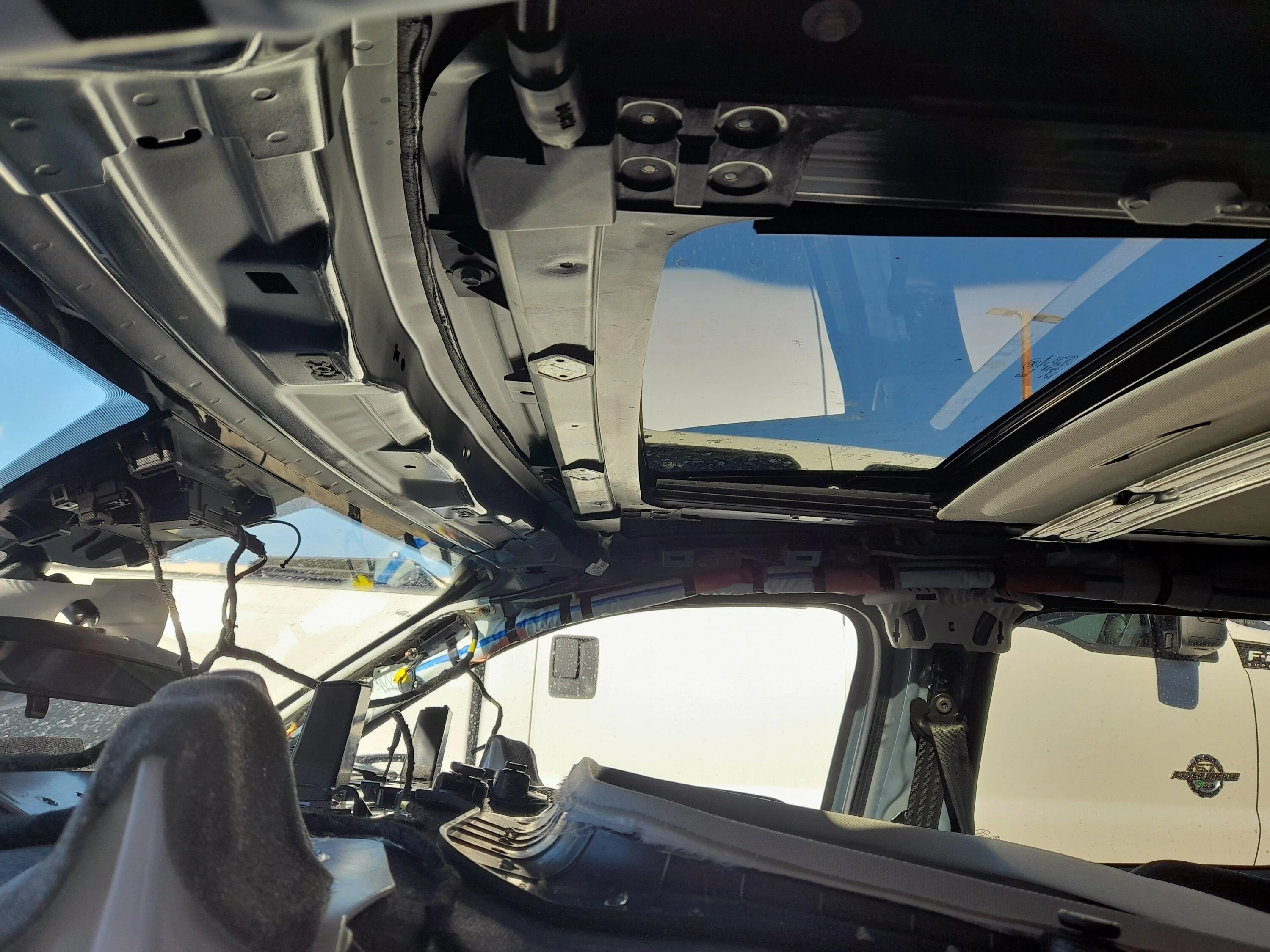 Ford Maverick MAV has custom shower... rain water leak @ map lights and sunroof switch 20230208_144636