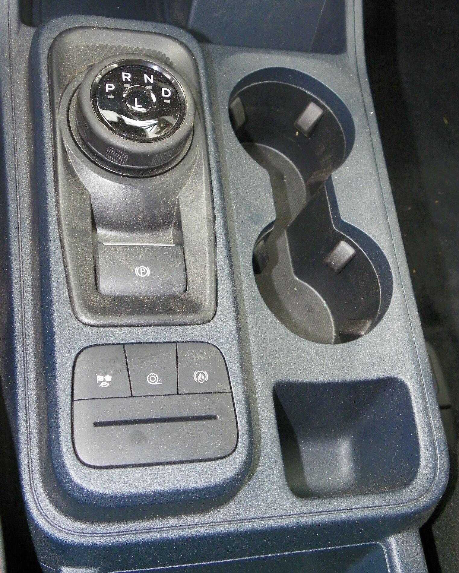 Ford Maverick TX State Fair Auto Show Center Console Shifter Mode buttons, Drink holders, Cubby hole.JPG
