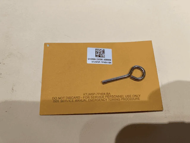Ford Maverick Weird small metal "key" in sealed envelope 1678391589326