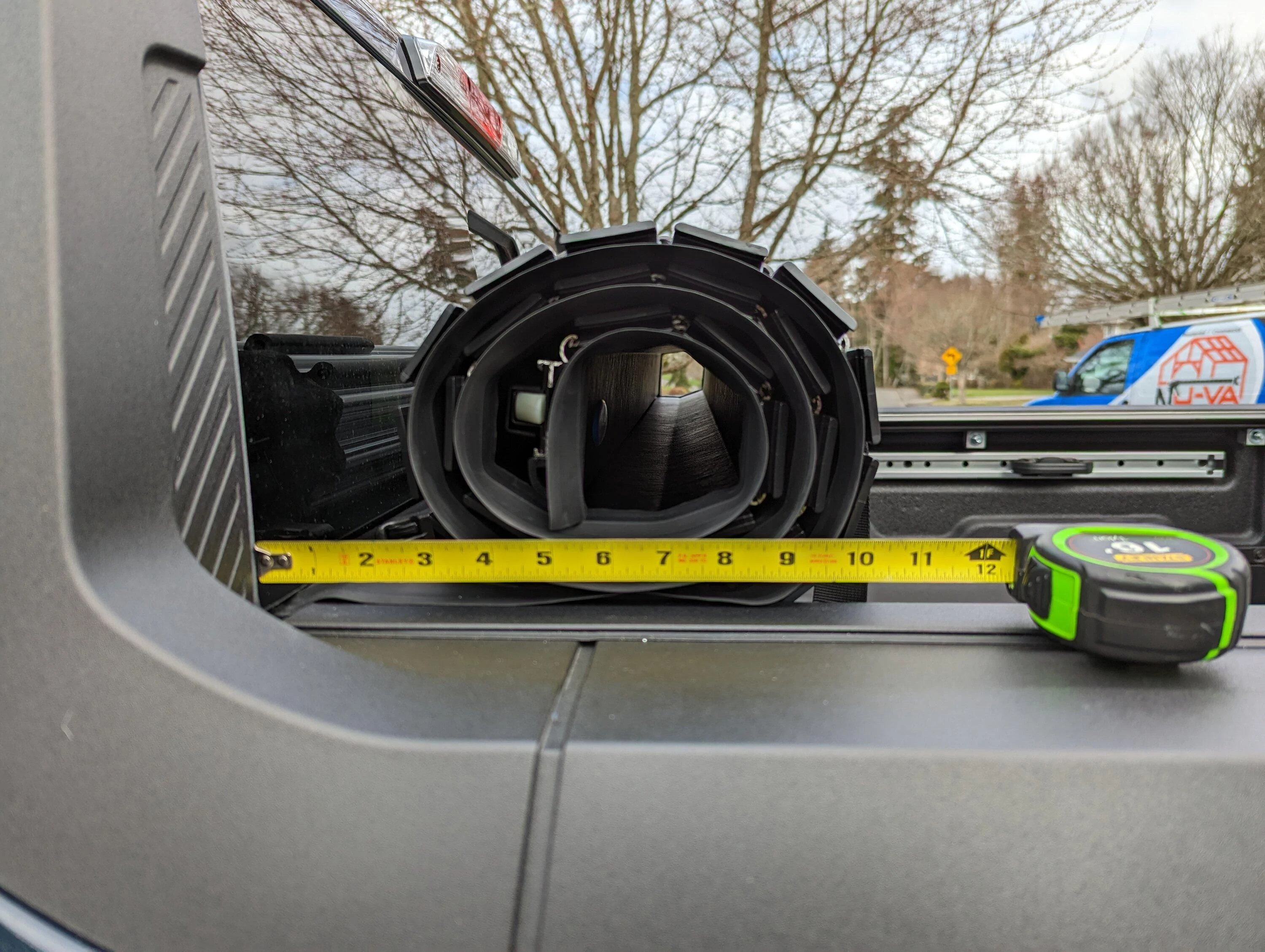 Ford Maverick Installed Elevate Racks, Ford Hard Roll-up Tonneau and Boeing airplane carpet rug PXL_20230311_182238723