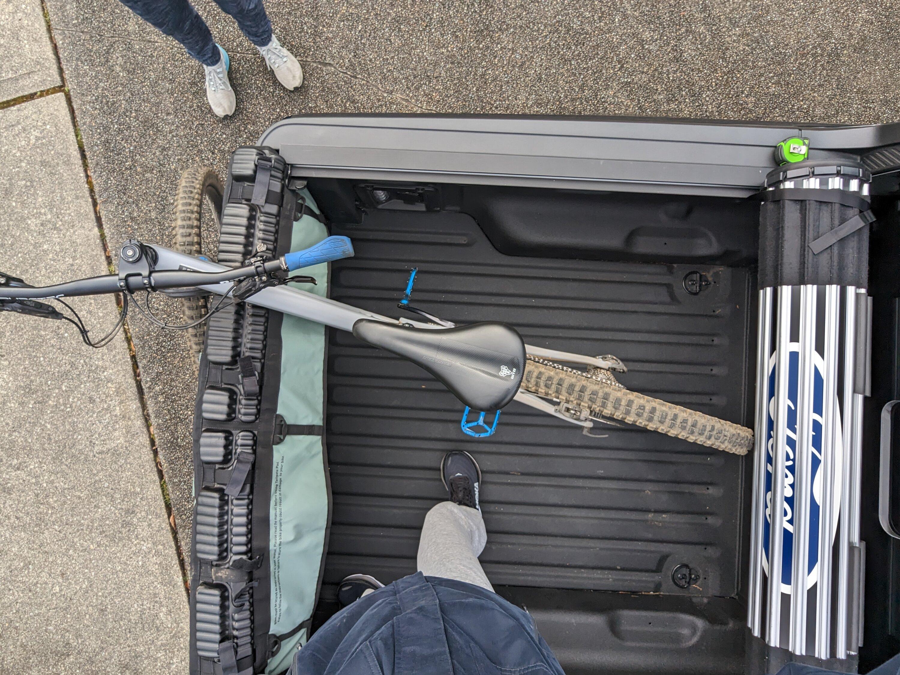 Ford Maverick Installed Elevate Racks, Ford Hard Roll-up Tonneau and Boeing airplane carpet rug PXL_20230311_182552642