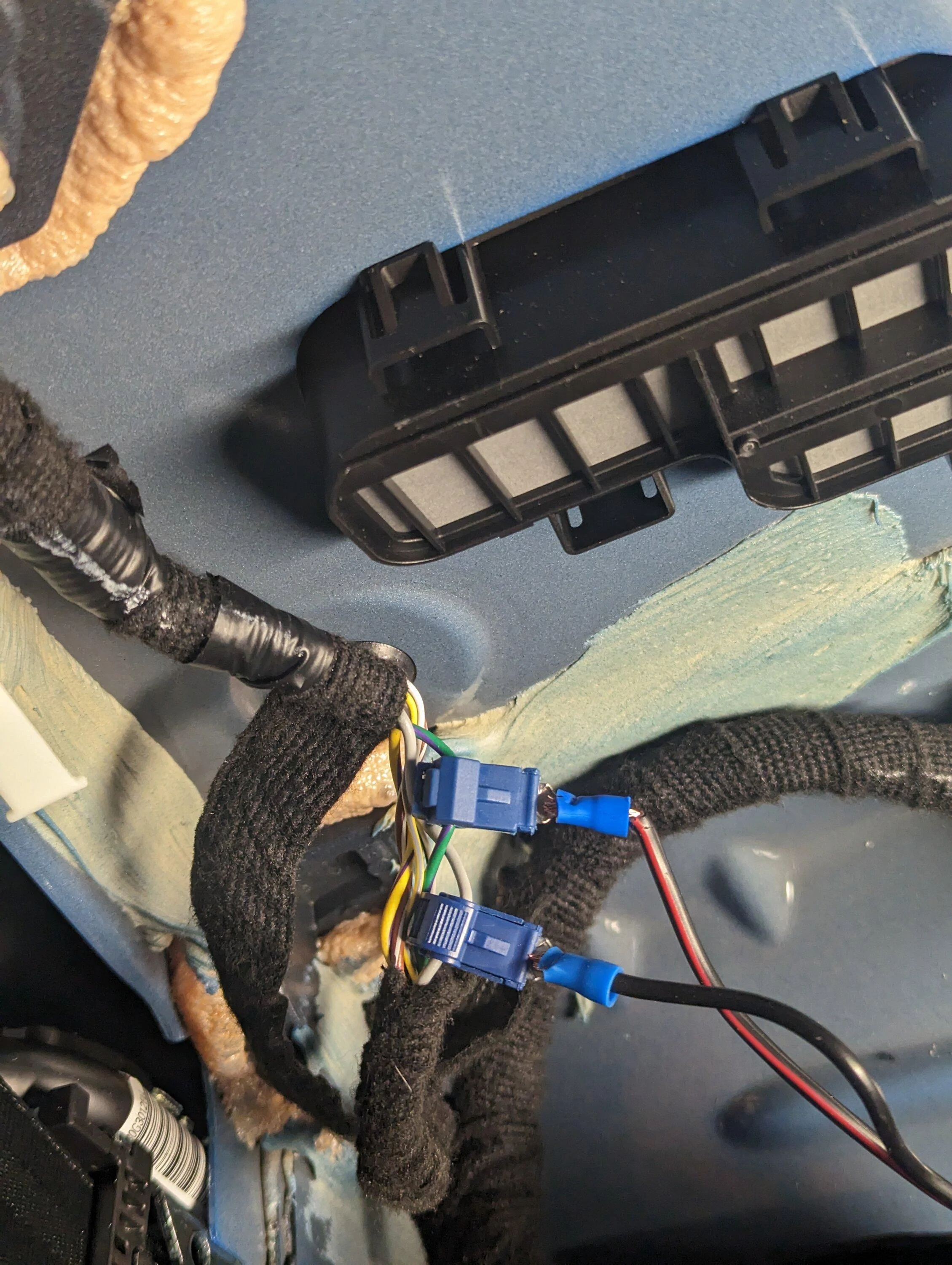Ford Maverick Rear speaker wires for sub install -- use this location to tap into the left and right speakers PXL_20230312_022000430